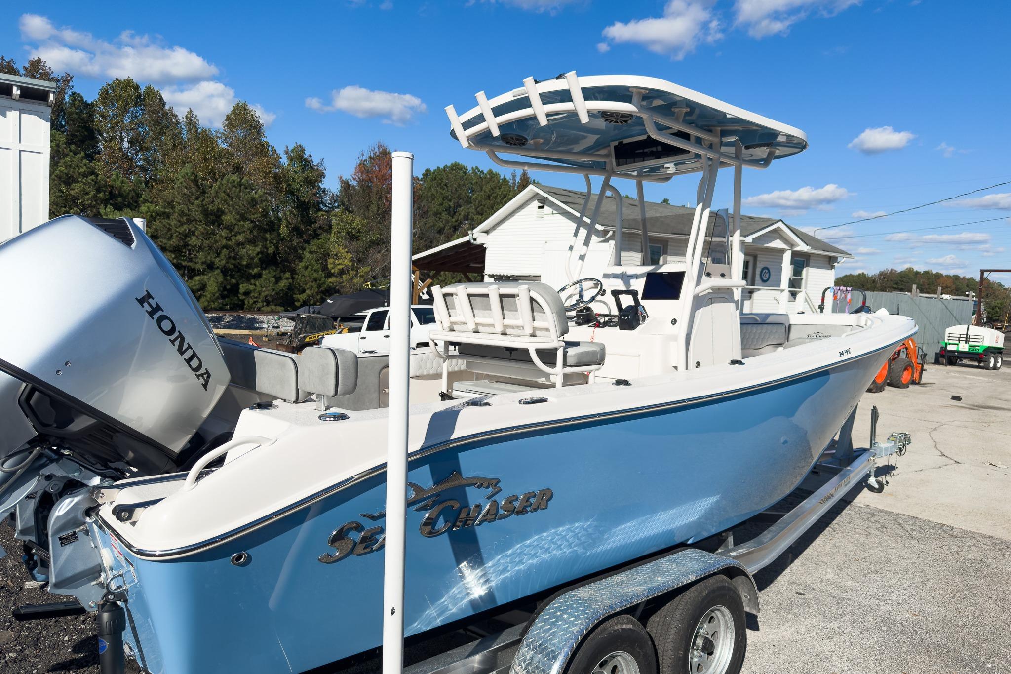 2026 Sea Chaser 24 HFC DE boat with Honda outboard motor on trailer.