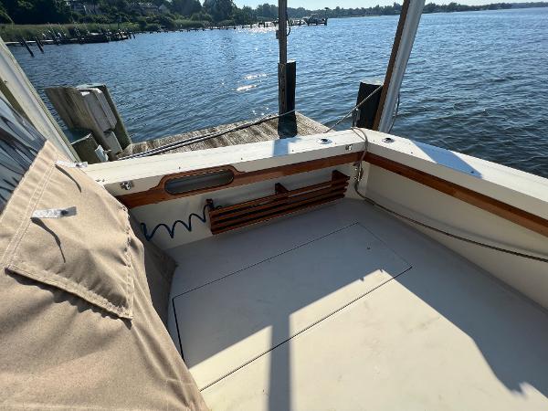 1985 Viking 35 Express at a dock with a view of the water.