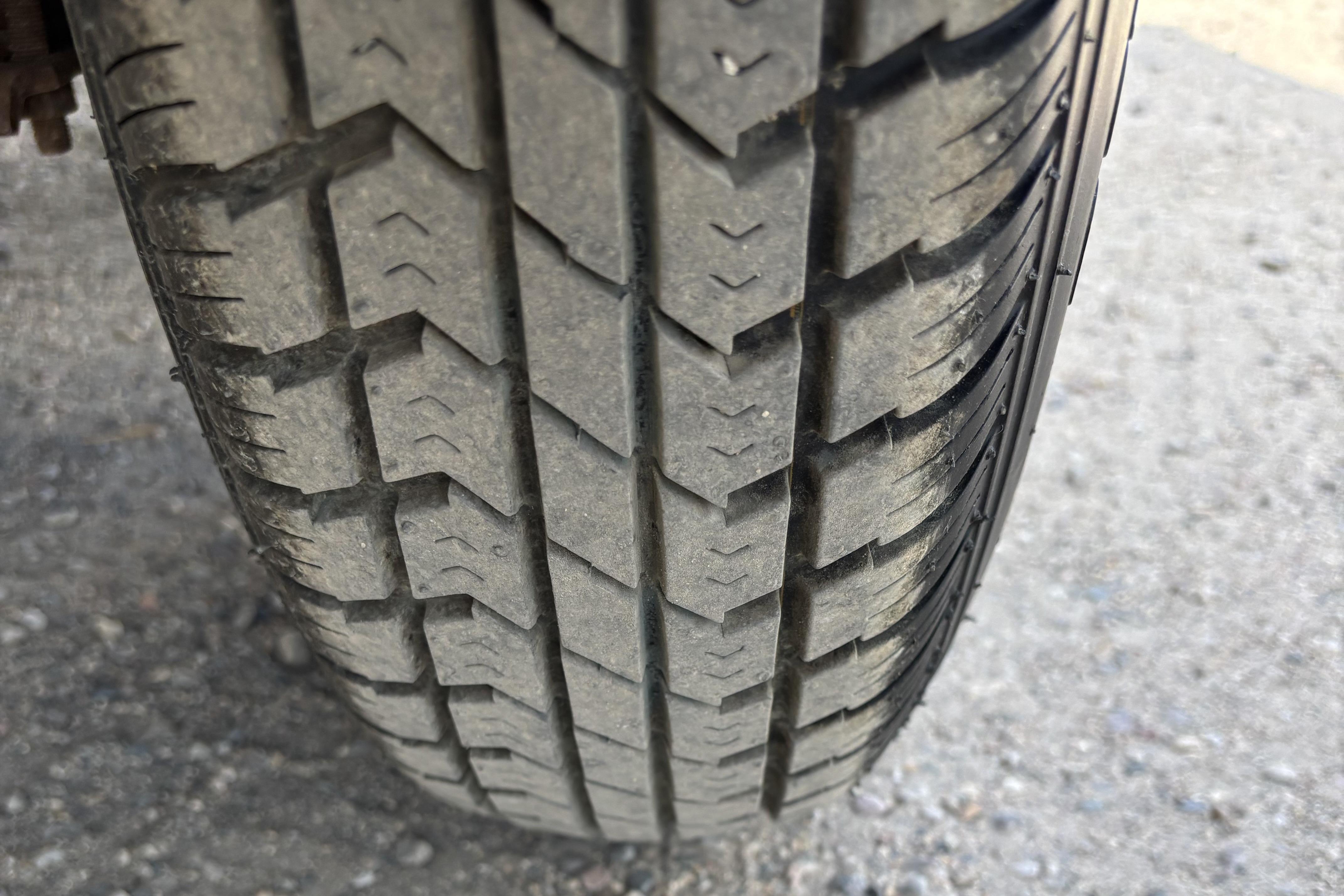 Close-up of a tire tread on a 1997 Northwood 24' Pontoon.