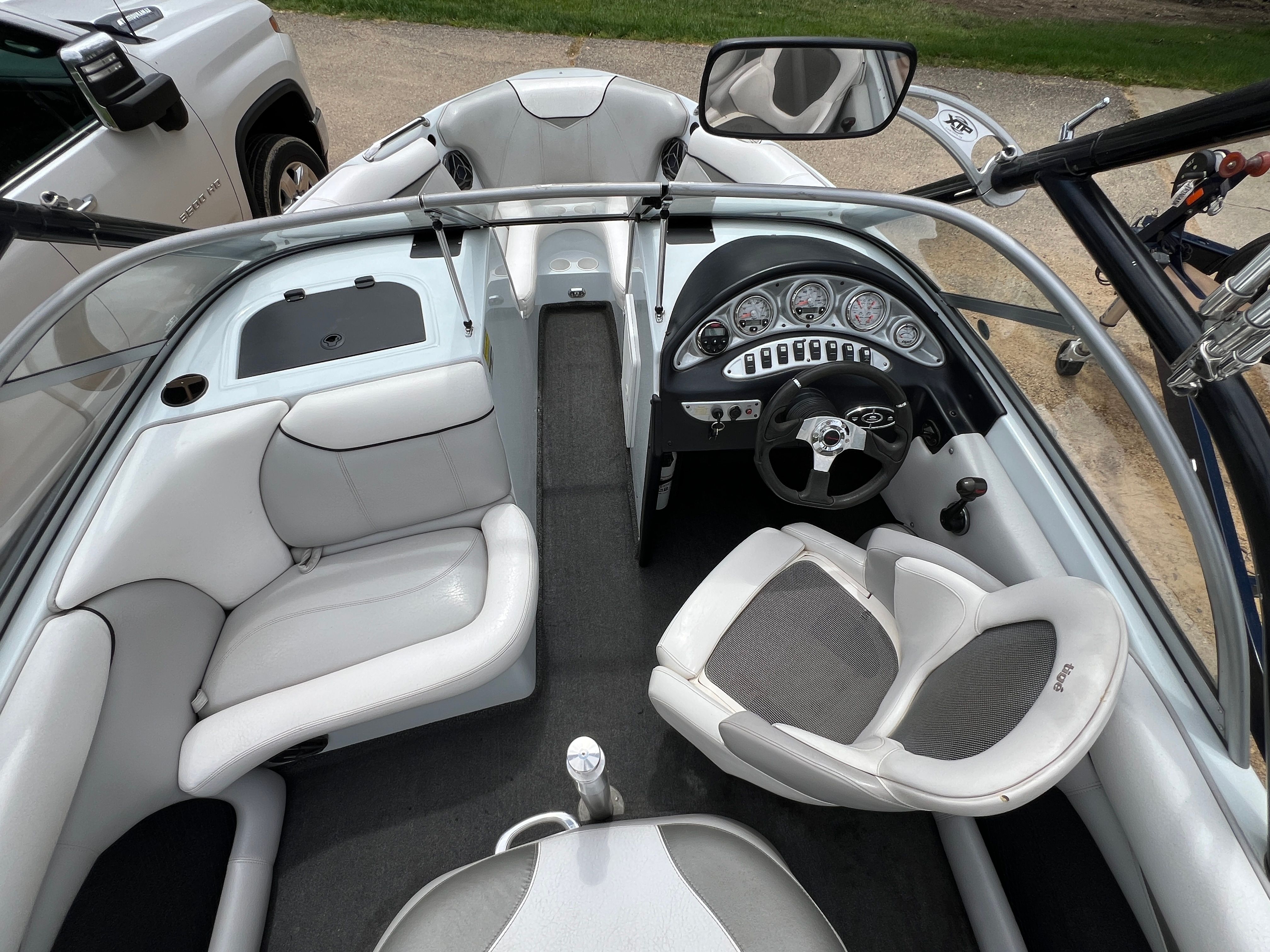 Interior view of a 2006 Tigé 20i with white seating and a modern dashboard.
