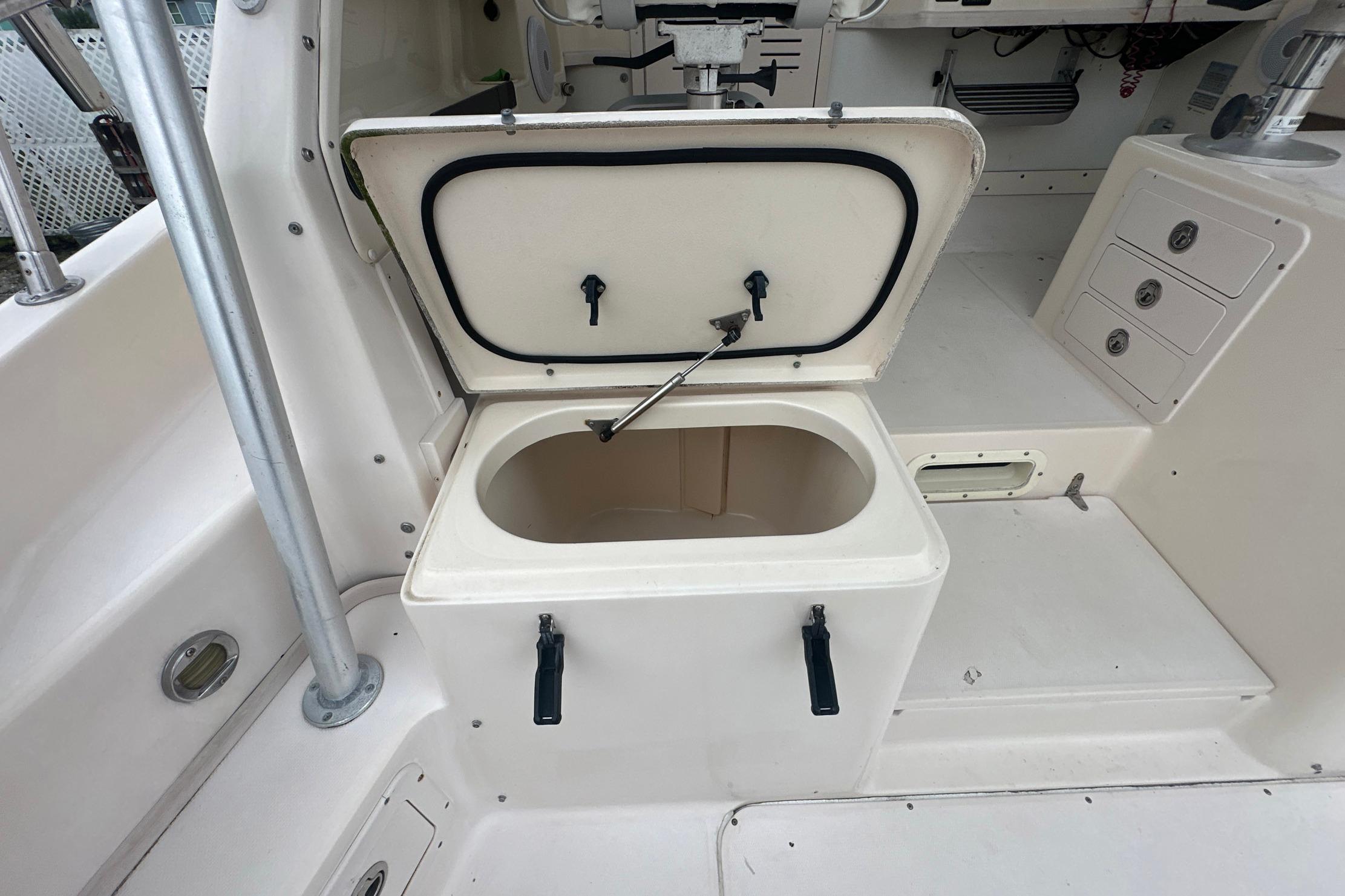 2006 Grady-White Marlin 300 boat interior with open storage compartment.