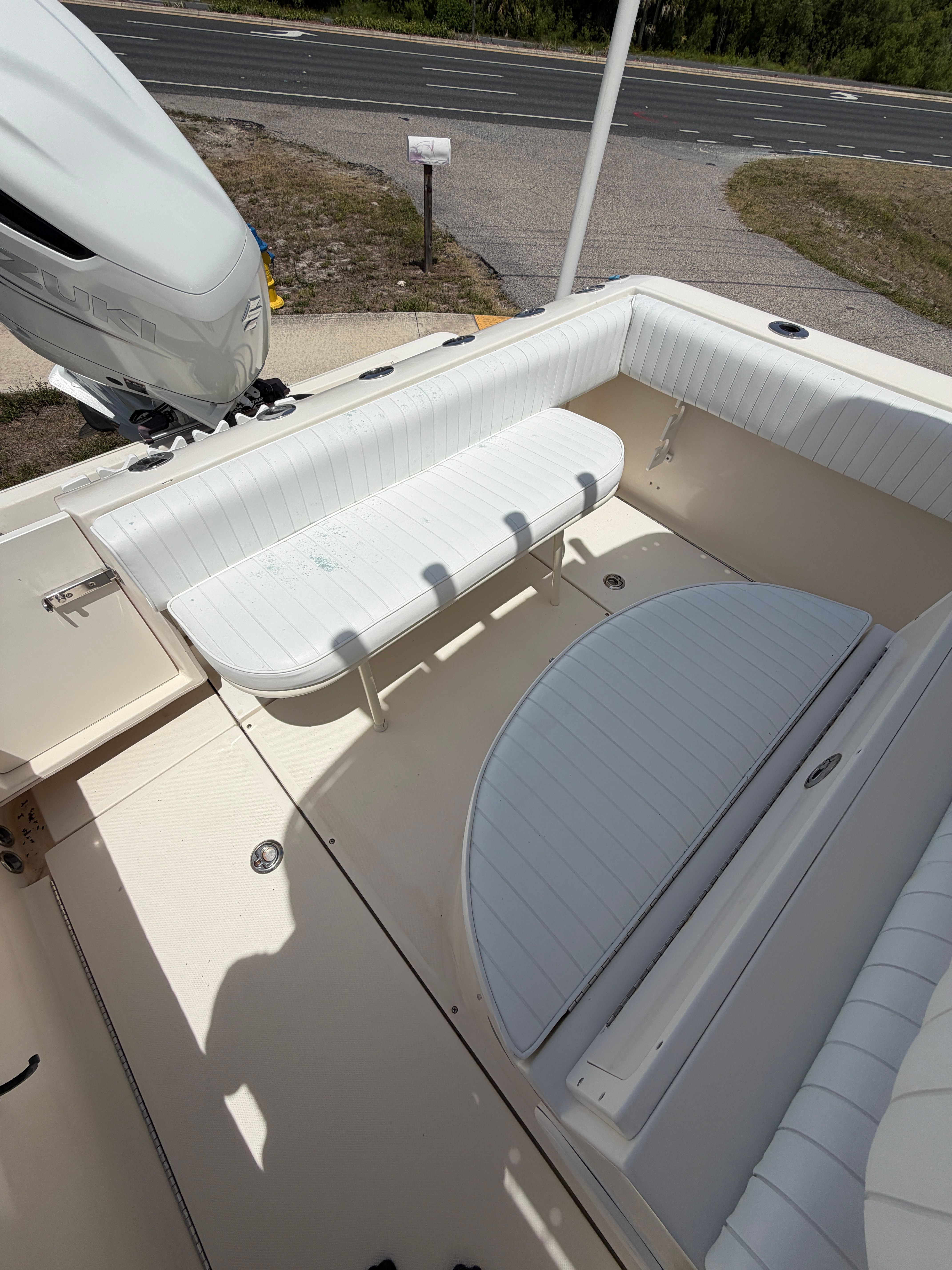Interior of a 2004 McKee Craft 24 FREEDOM boat with white seating.