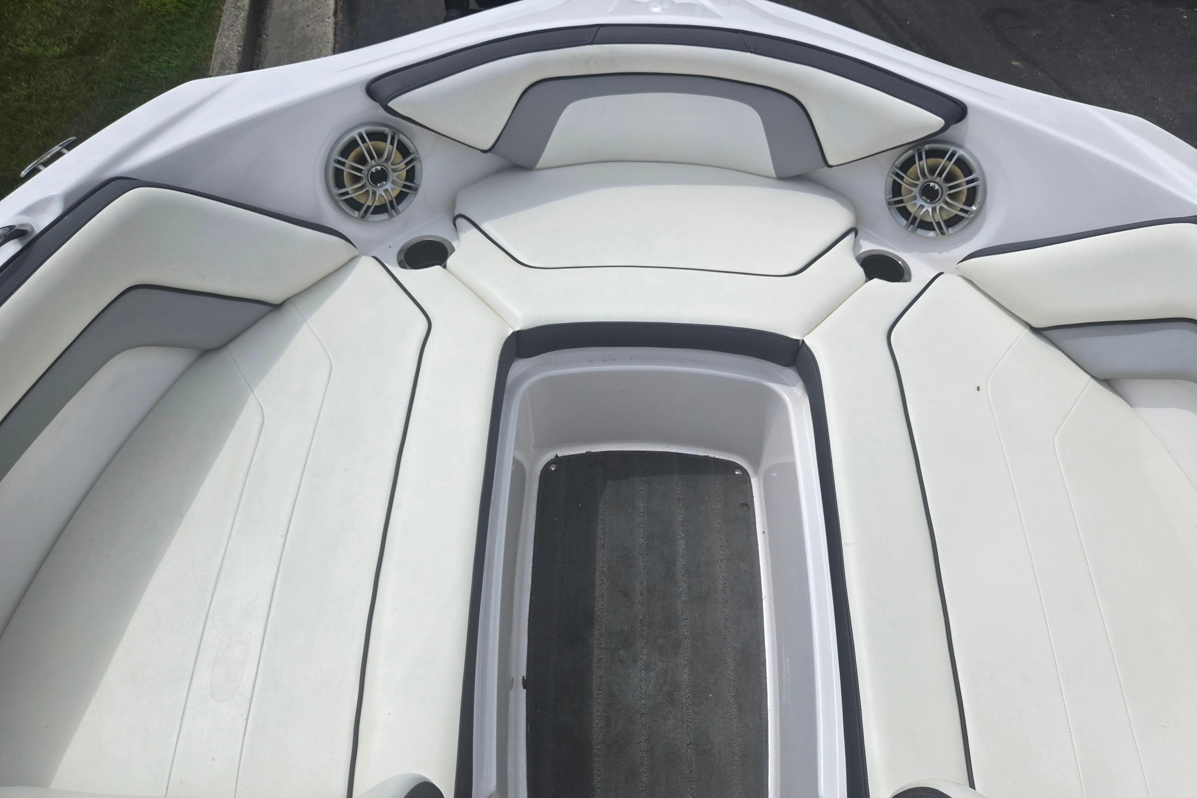 2016 Yamaha Boats AR192 interior with white cushioned seating and built-in speakers.