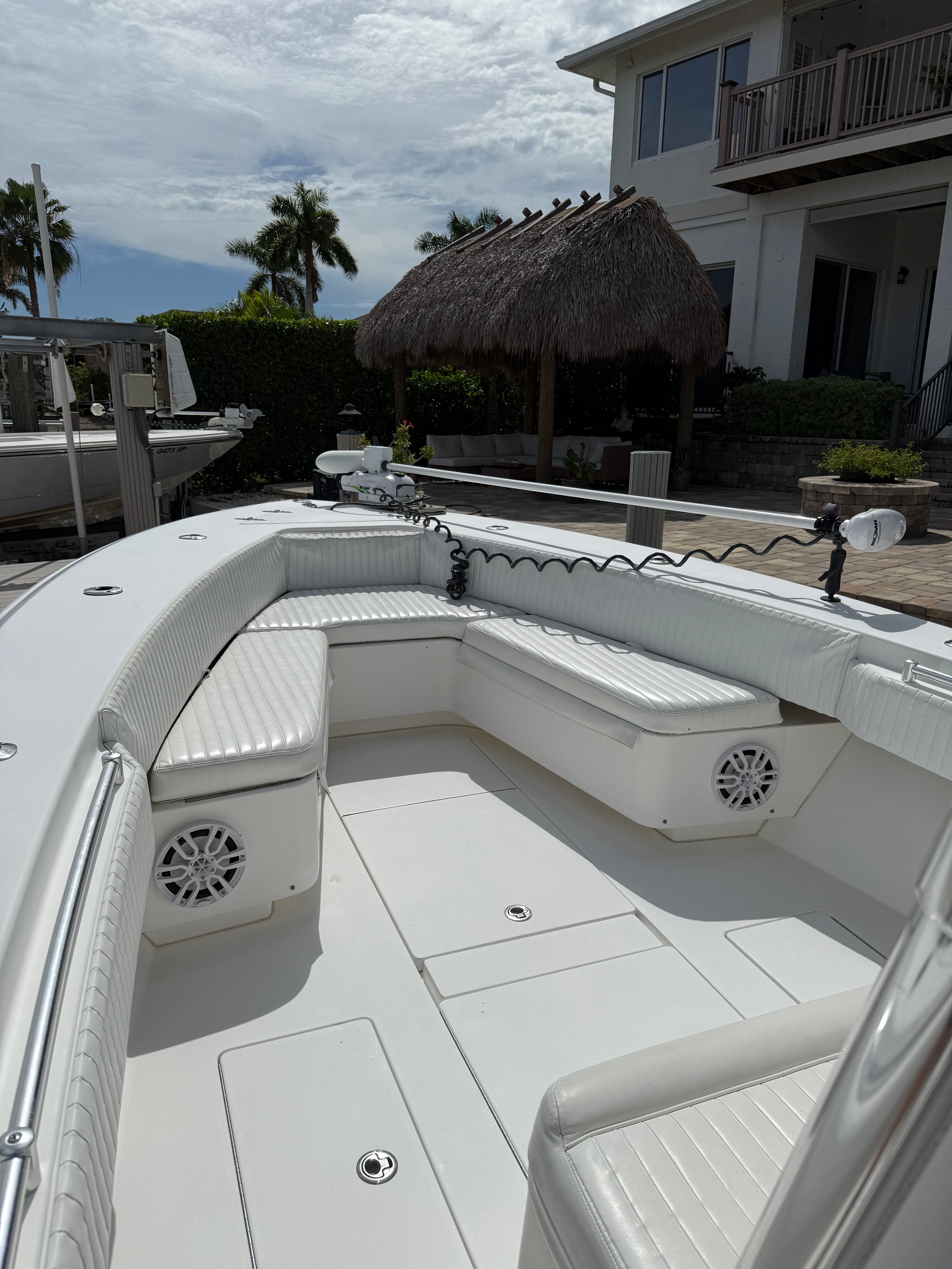 2012 Contender 32 ST boat with white interior and seating area.