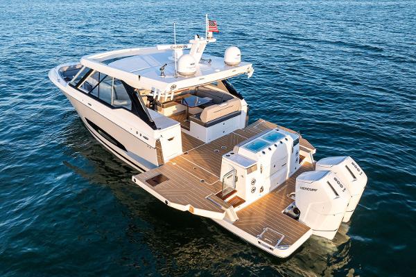 Manufacturer Provided Image: 2026 Regal LX43 luxury boat cruising on open water, showcasing sleek design and powerful engines.