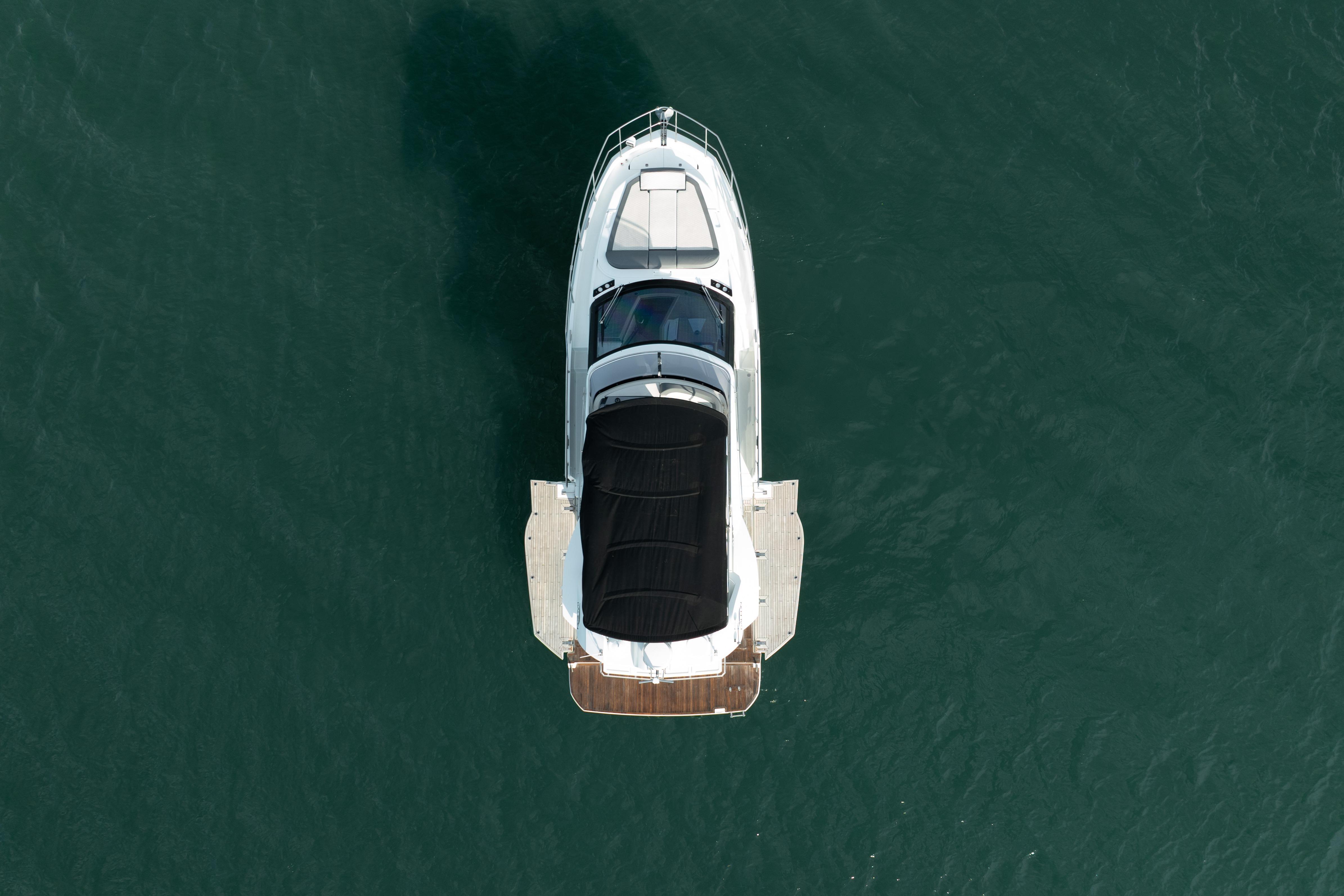 Aerial view of 2023 Galeon 400 Fly yacht on calm water.