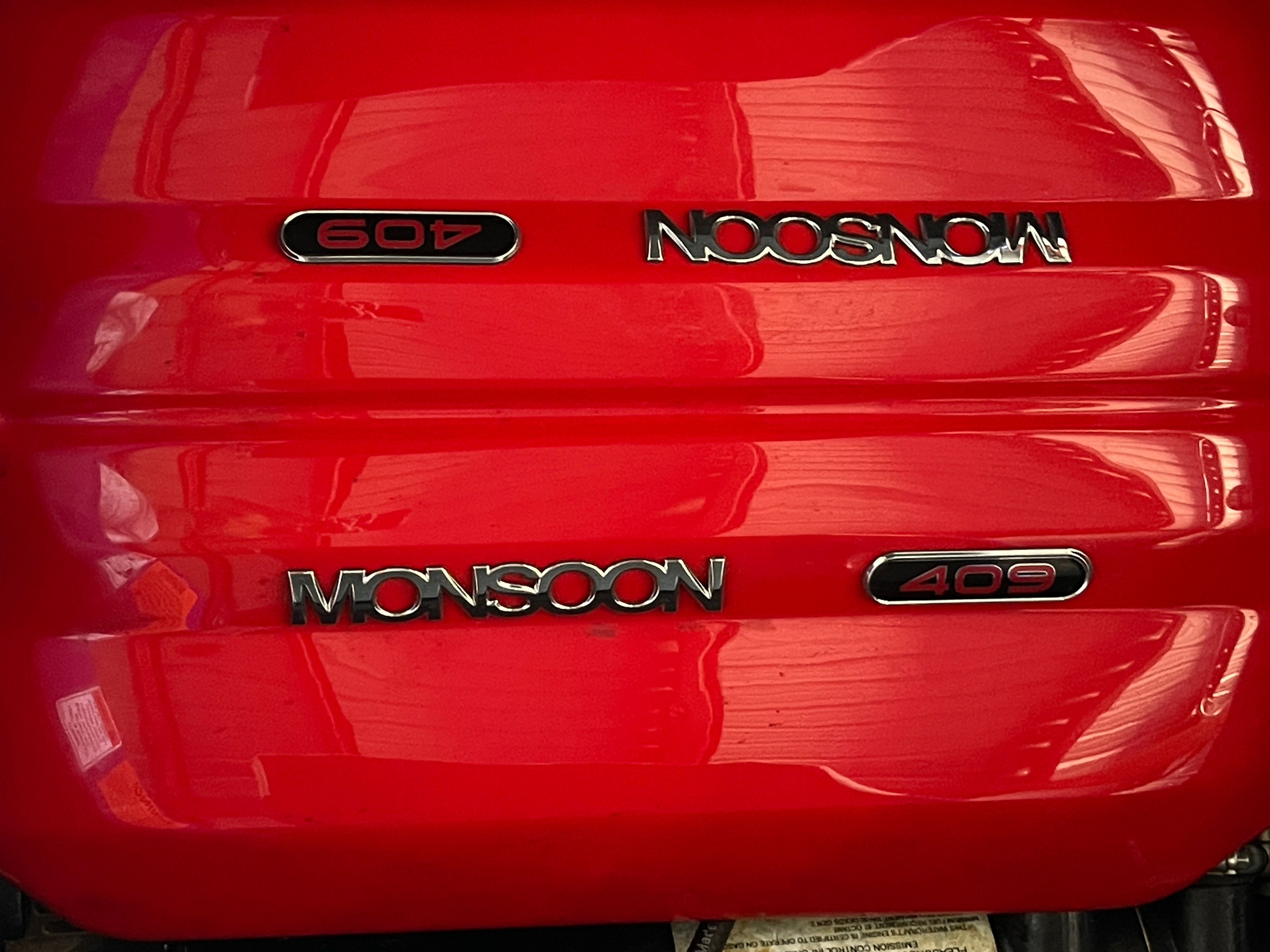 Red engine cover with "Monsoon 409" lettering.