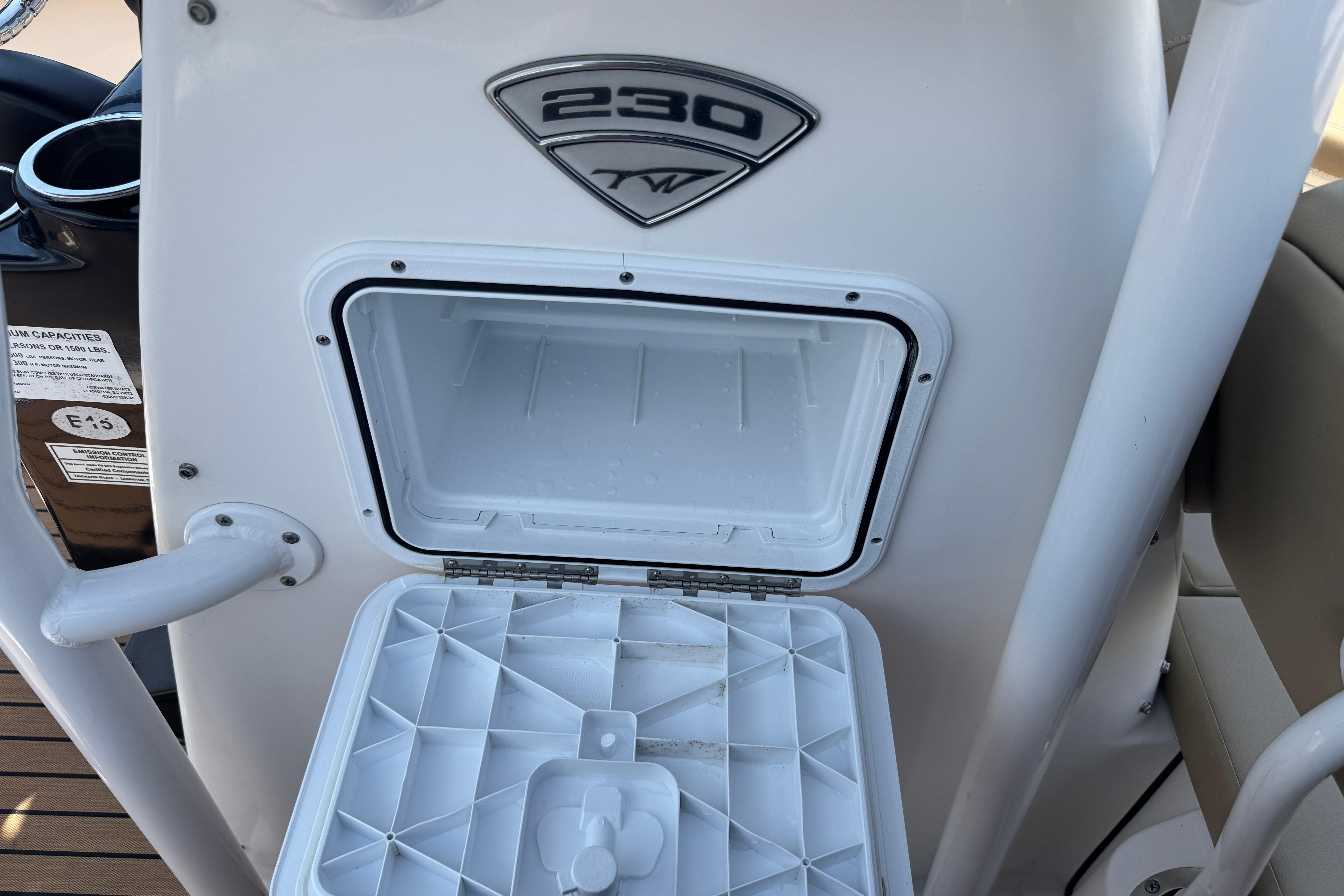 Open storage compartment on a 2016 Tidewater 230 LXF boat.
