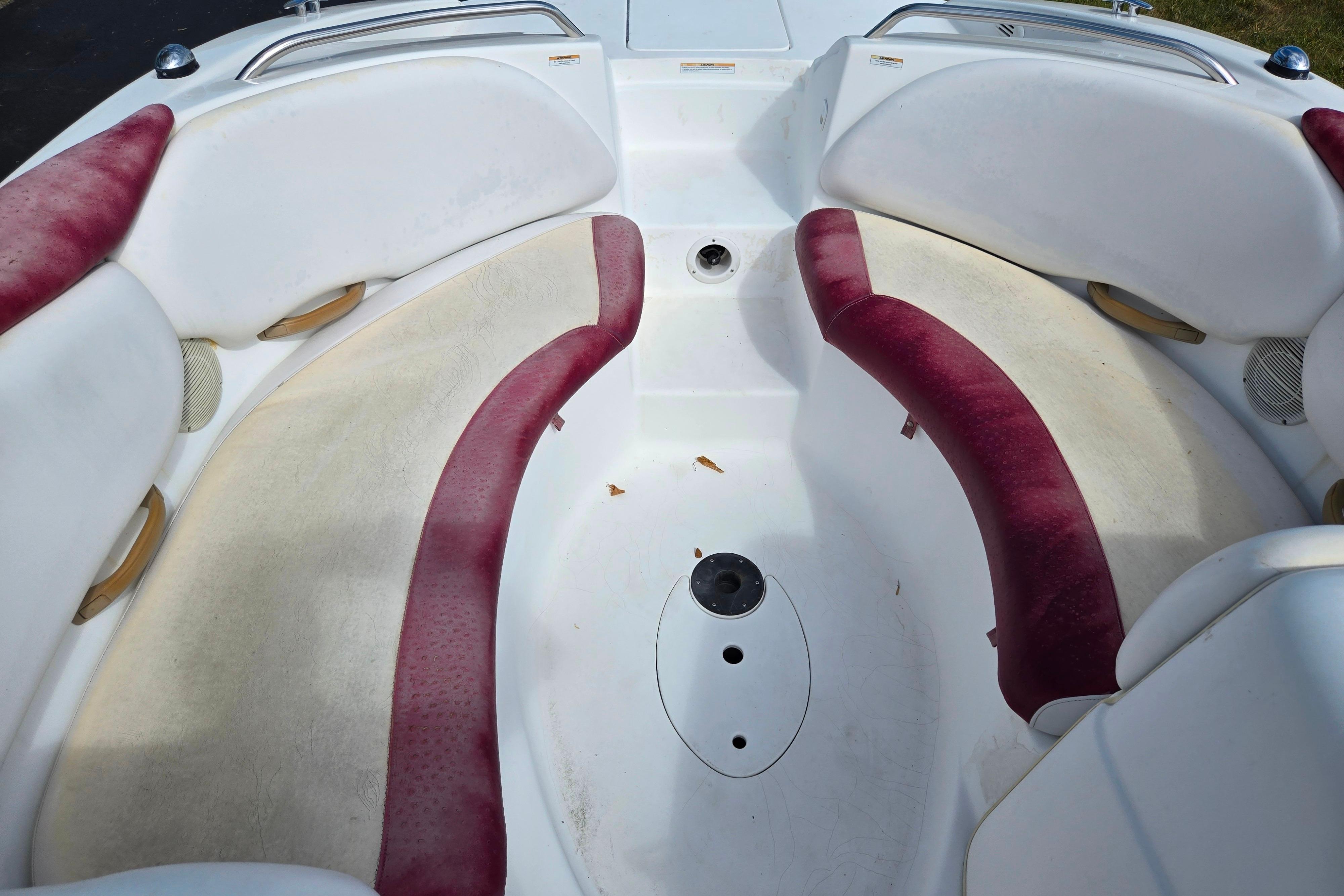 2004 Sea-Doo Islandia boat interior with white and red seating arrangement.