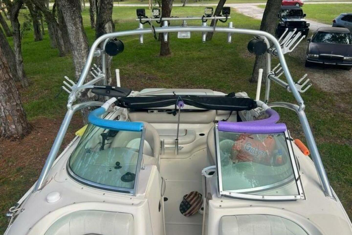 2003 Sea Ray 220 Bow Rider boat with wakeboard tower and accessories.