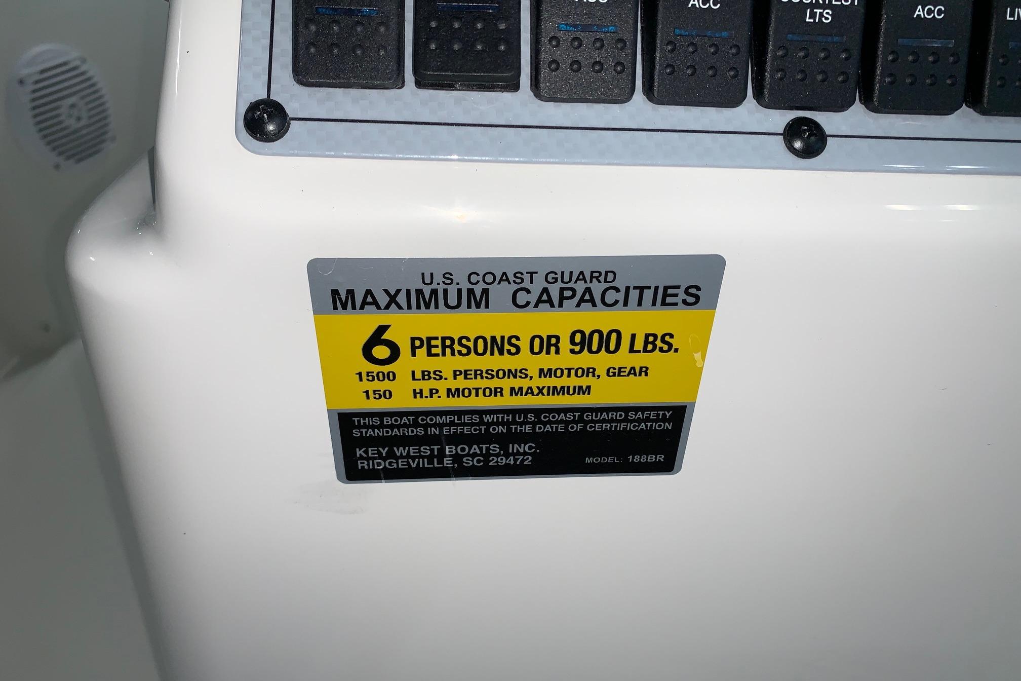Key West 188 Bay Reef 2026 boat capacity label, 6 persons or 900 lbs maximum.
