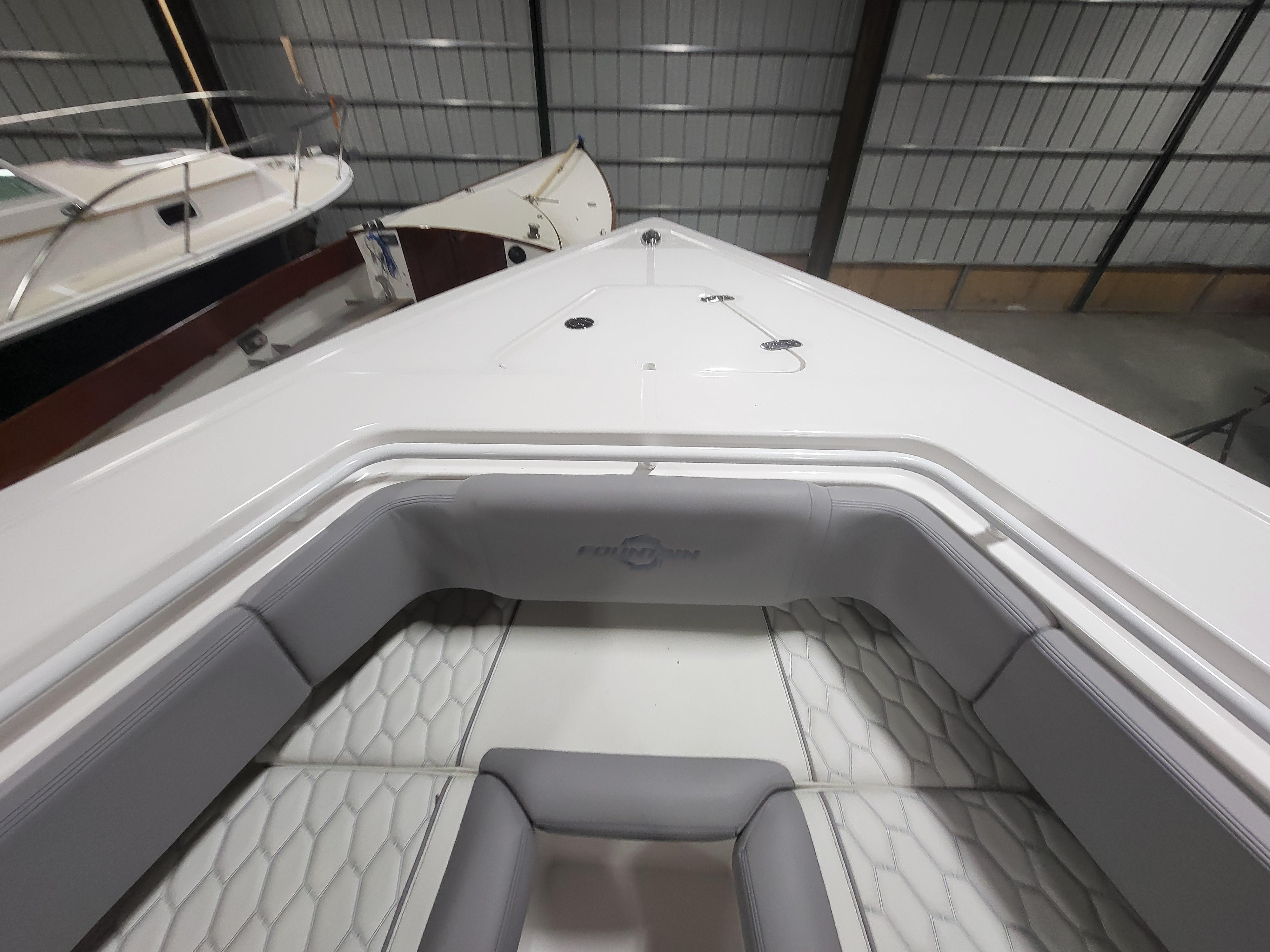 2022 Fountain 38 SC boat interior with sleek seating in a storage facility.