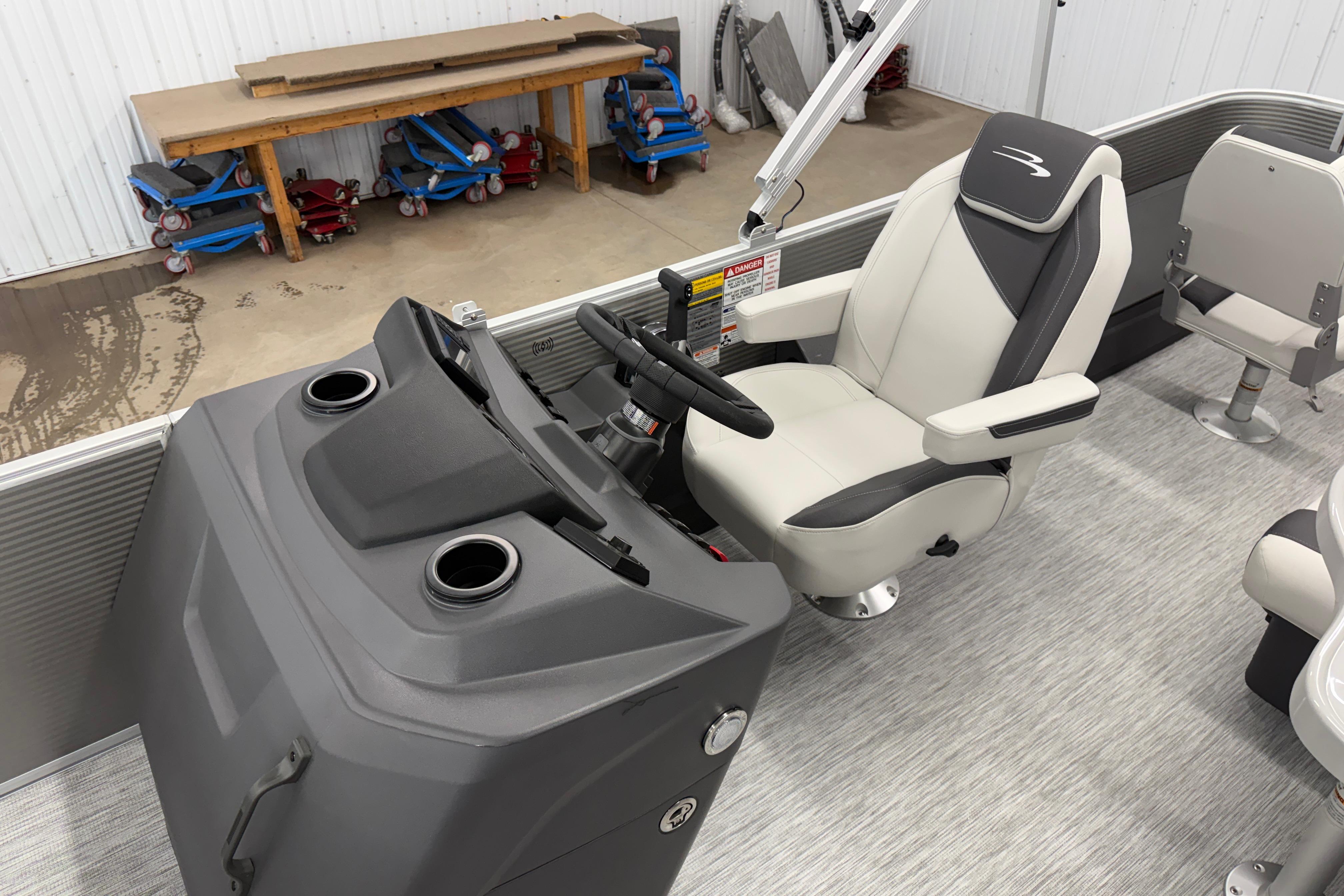 2026 Bennington 20 SF boat interior with captain's chair and steering console.
