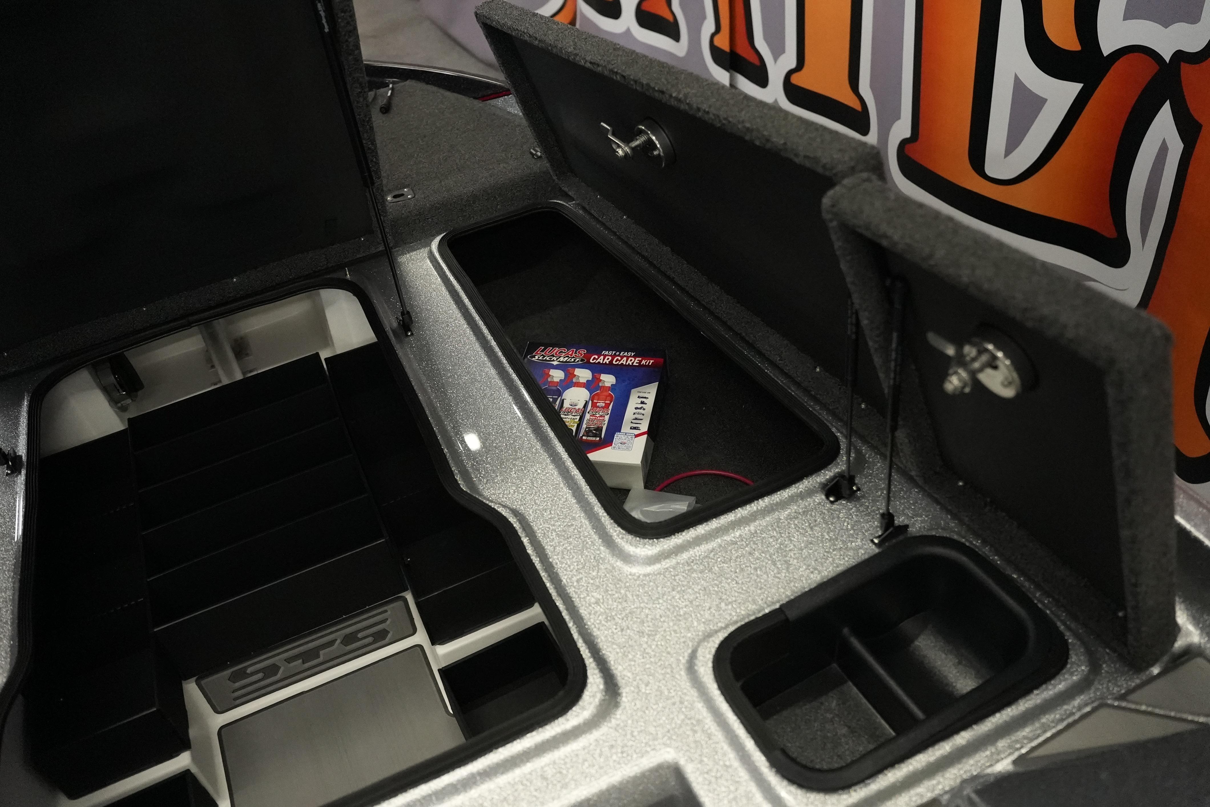 2026 Bass Cat Lynx STS storage compartments with Lucas Oil care kit.