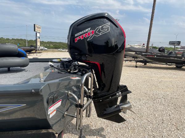 2025 Ranger RT188P boat with Mercury Pro XS engine, parked on gravel lot.