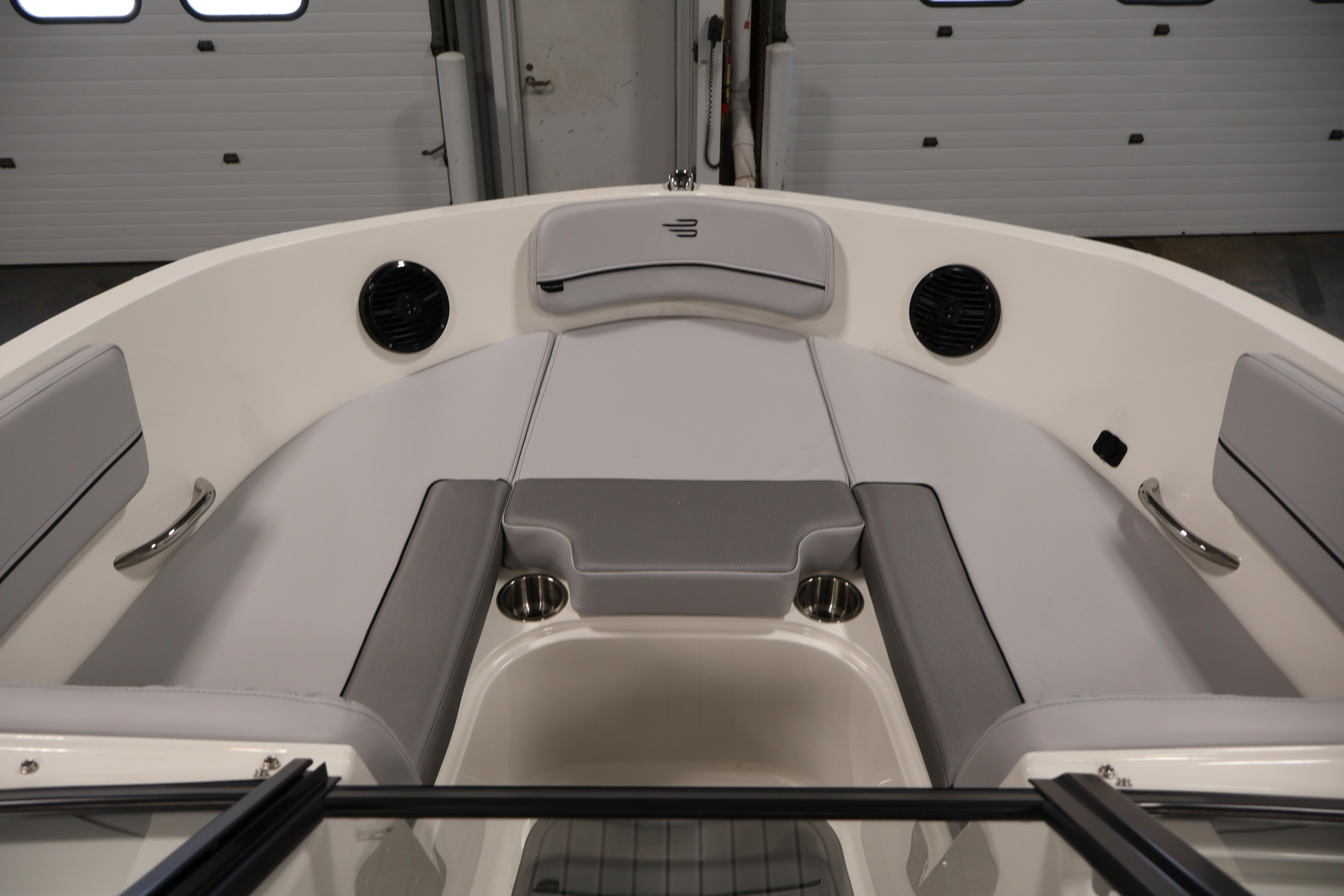 2026 Bayliner VR6 Bowrider I/O interior with gray seating and cup holders.