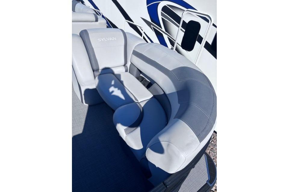 Luxurious seating on 2022 Sylvan L3 DLZ Bar pontoon boat, featuring sleek gray upholstery.