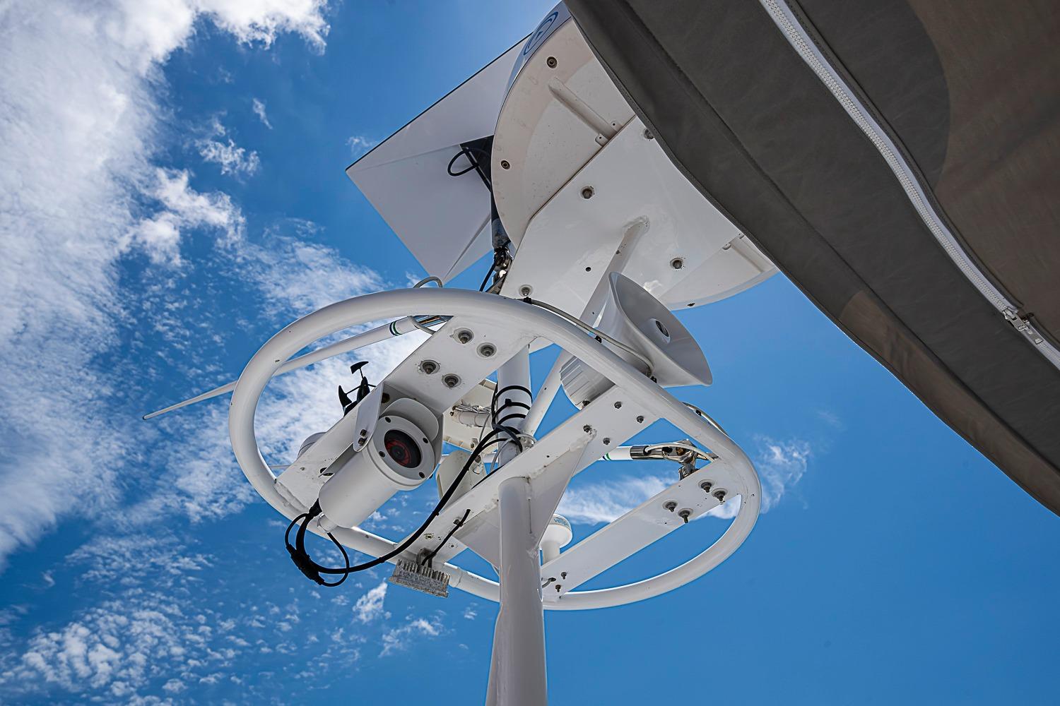 Radar and camera equipment on Magna Marine Nova Scotia 47, 2003, against a clear blue sky.