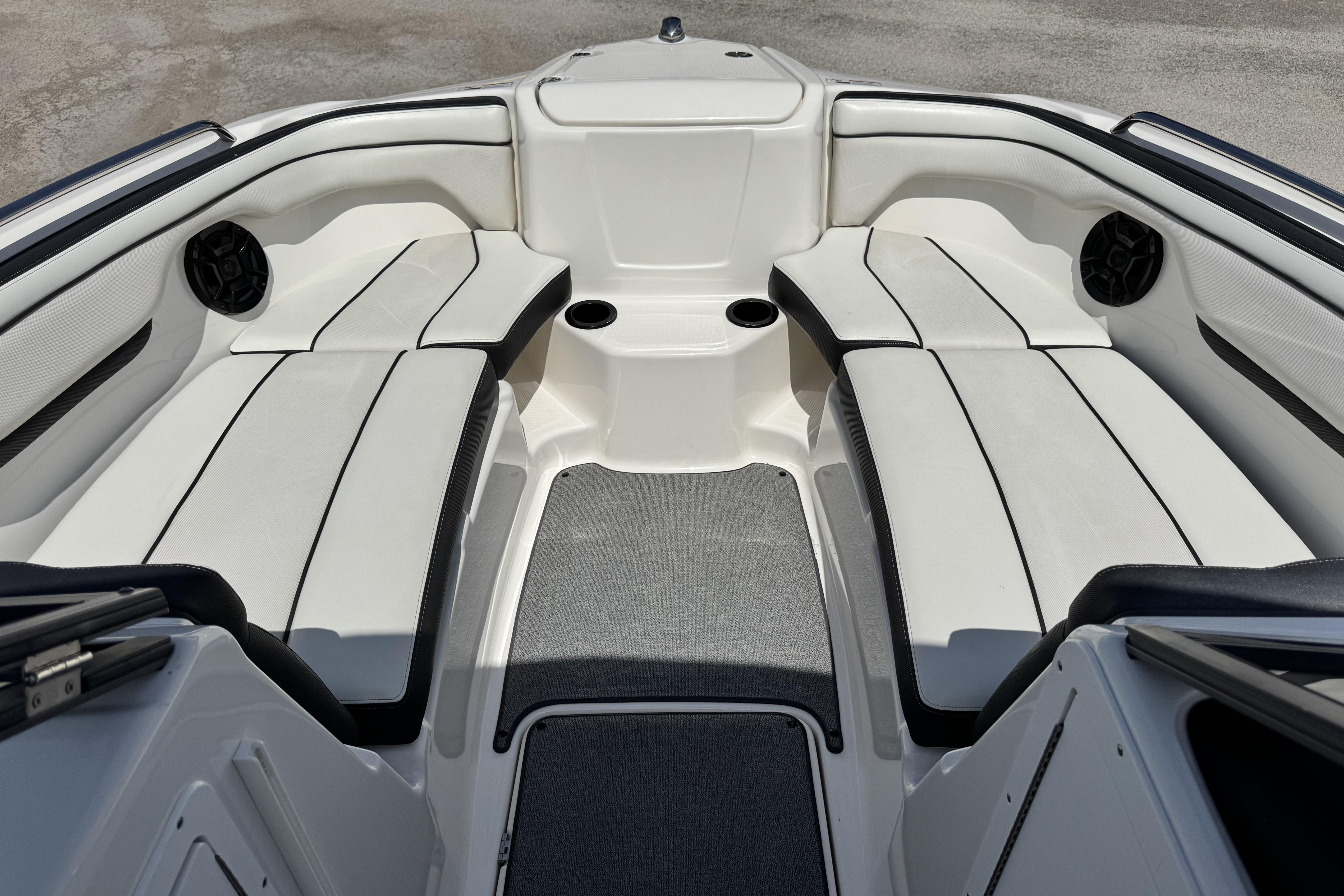 2018 Yamaha Boats AR210 interior with white seating and cup holders.