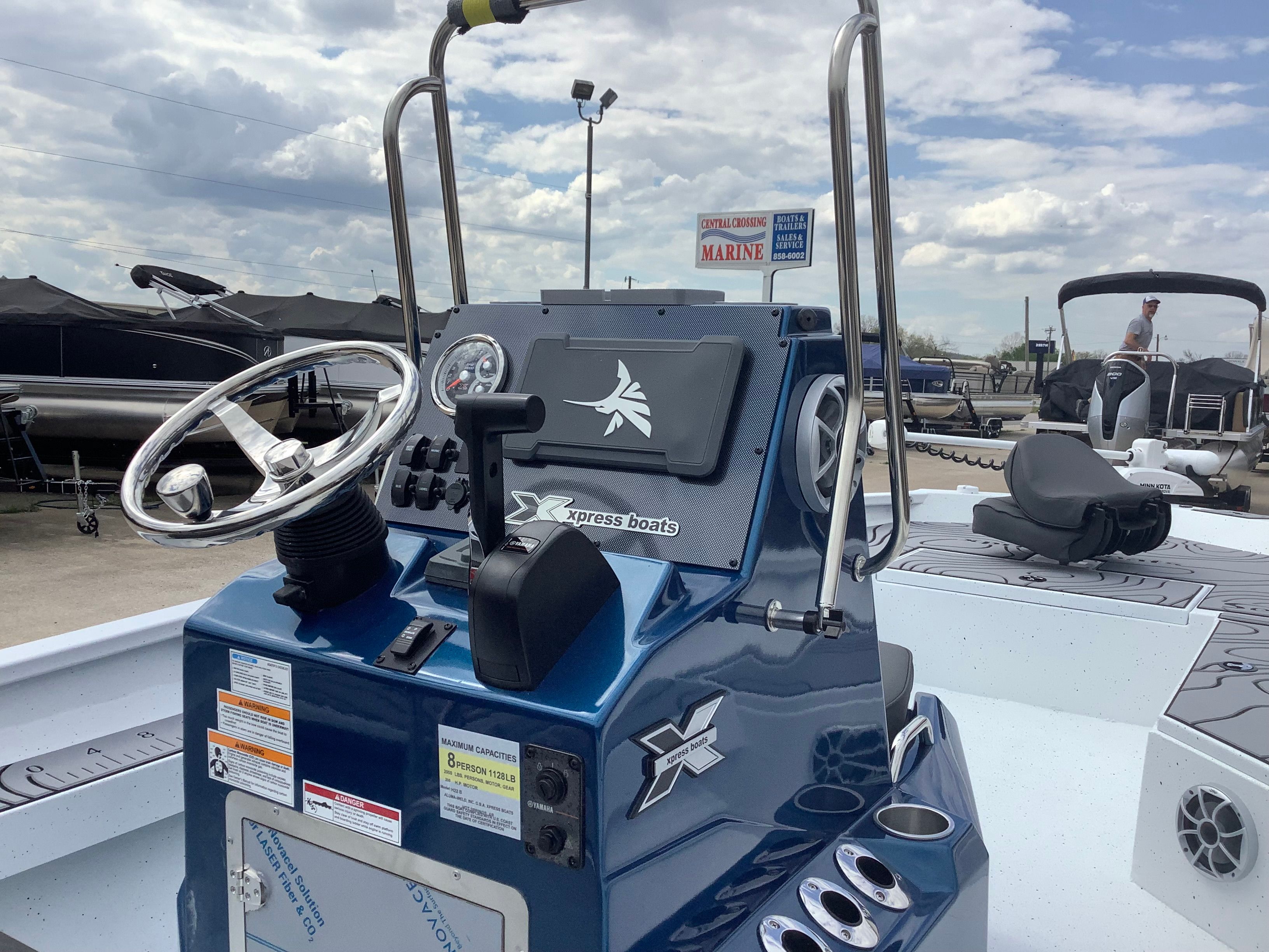 2026 Xpress H22B Bay boat console outdoors.