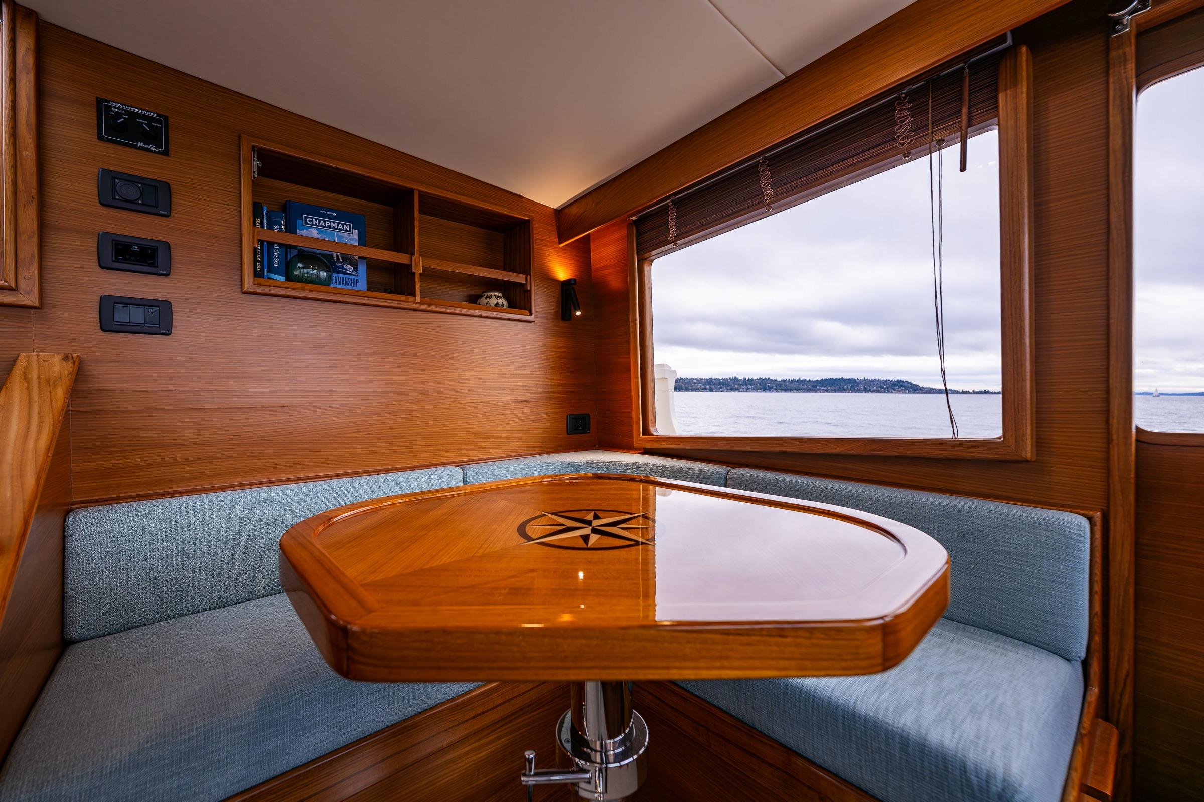 Luxurious interior of 2026 Fleming 55 Pilothouse yacht with ocean view.
