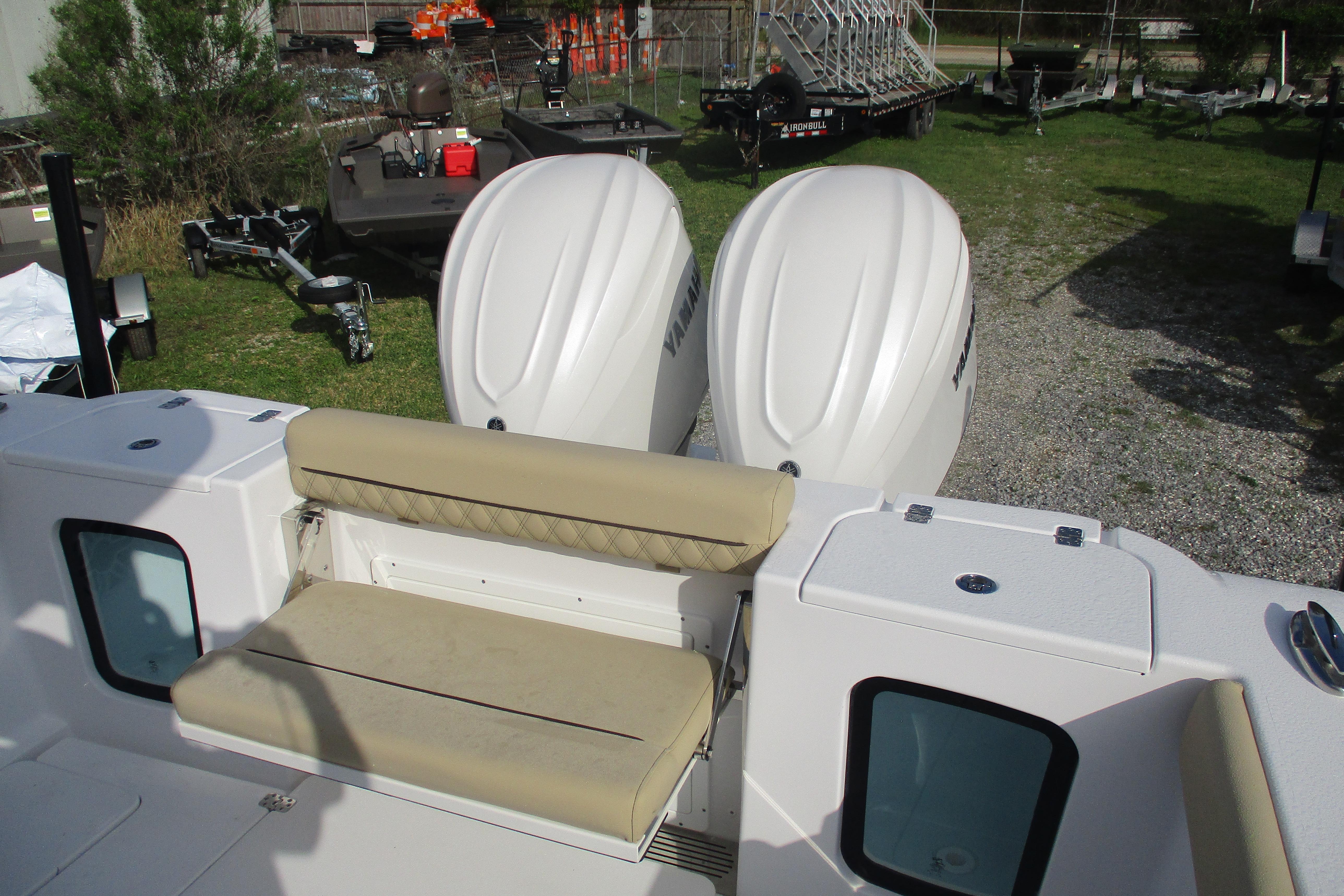 2026 Sportsman Open 302 Center Console with dual engines and beige seating.