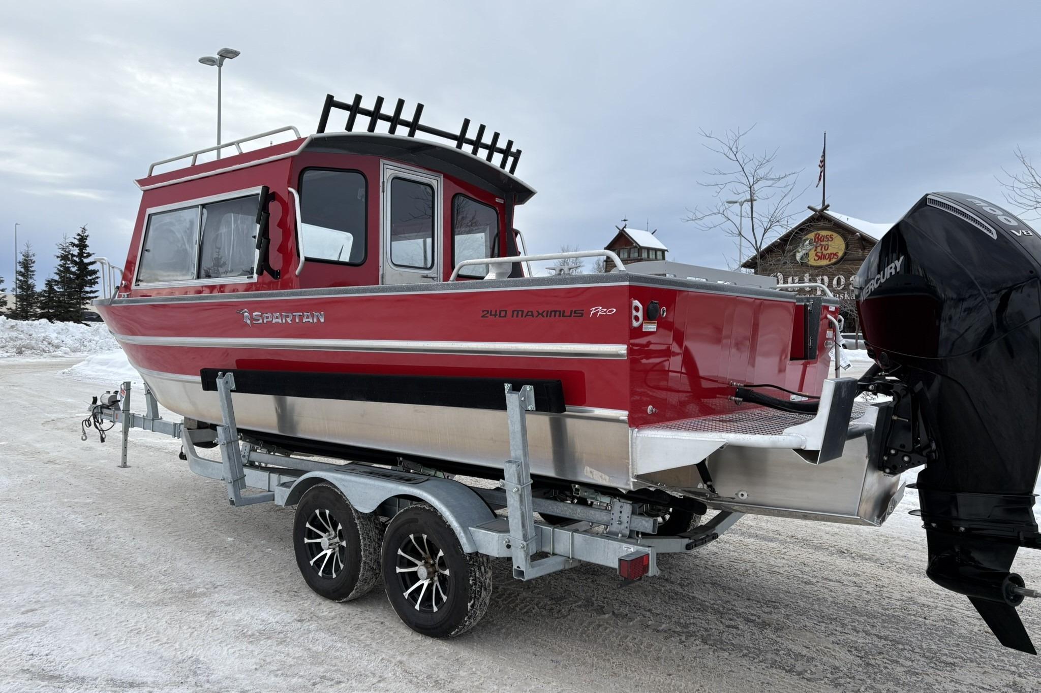2024 Spartan 240 Maximus Pro boat on trailer in snowy setting.