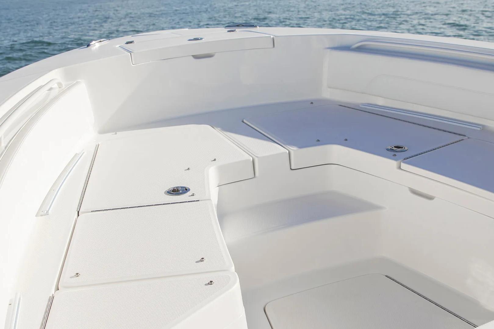 2027 Regulator 24XO boat interior with sleek seating and storage, on calm water.