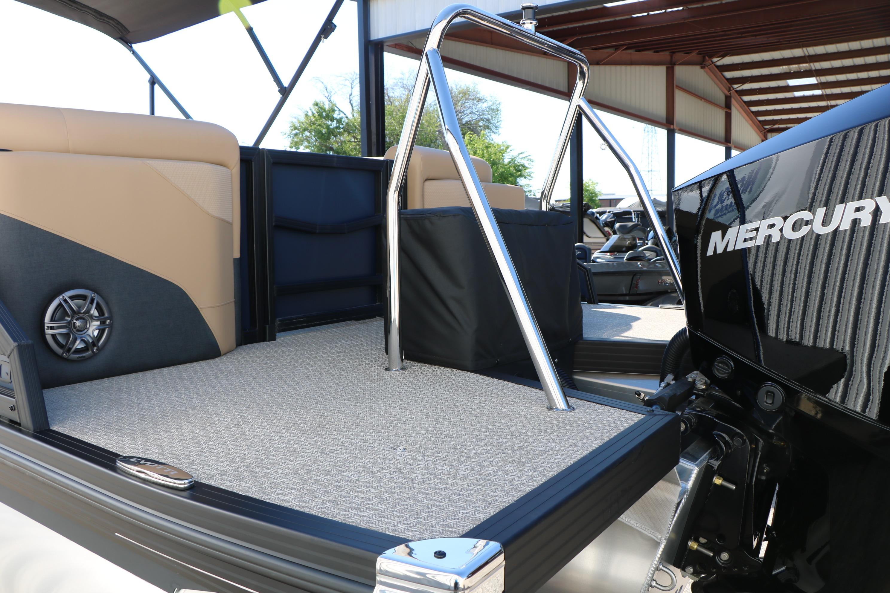 2026 Evotti 525 QL Tri-Toon boat interior with Mercury engine, featuring sleek design and seating.