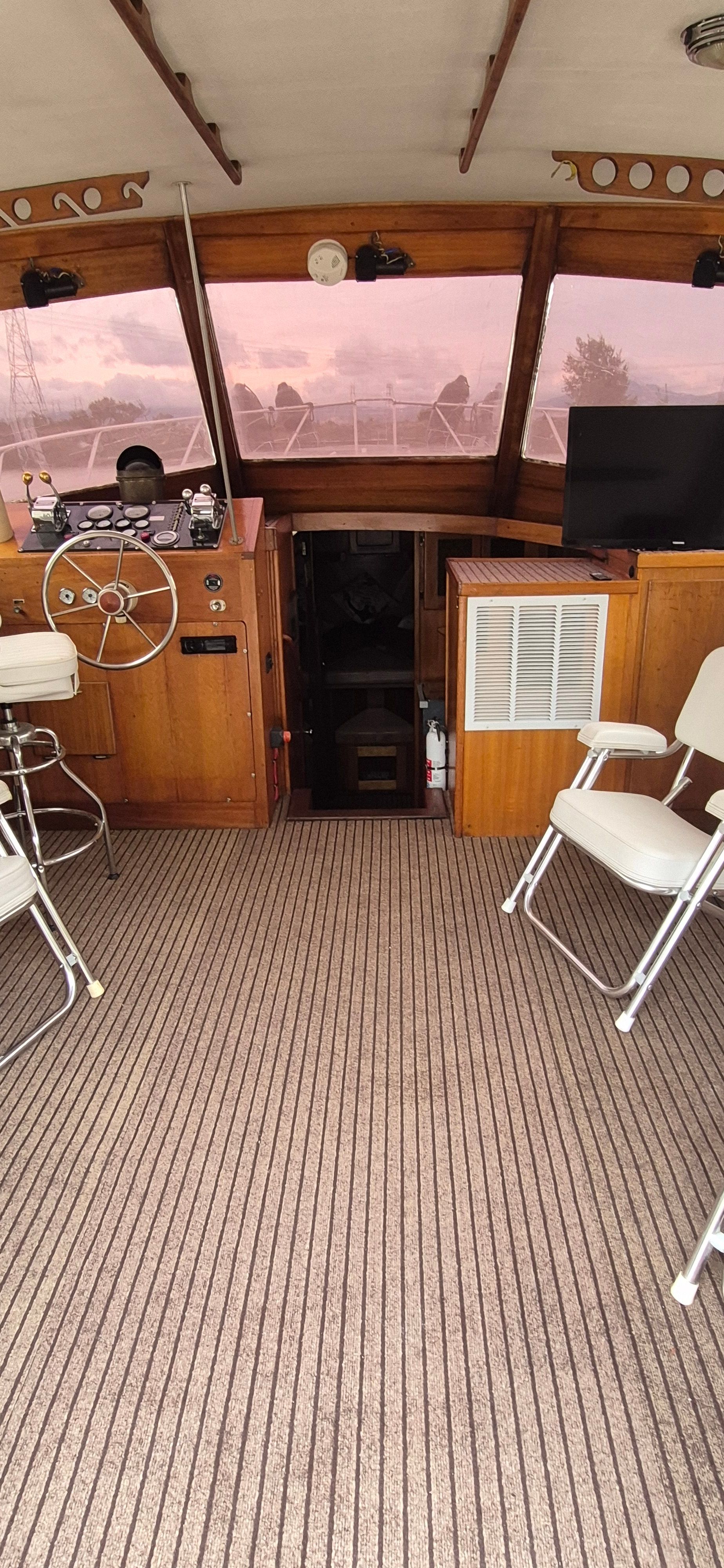 Interior of a 1976 Egg Harbor 33 Sportfisher with wooden furnishings.