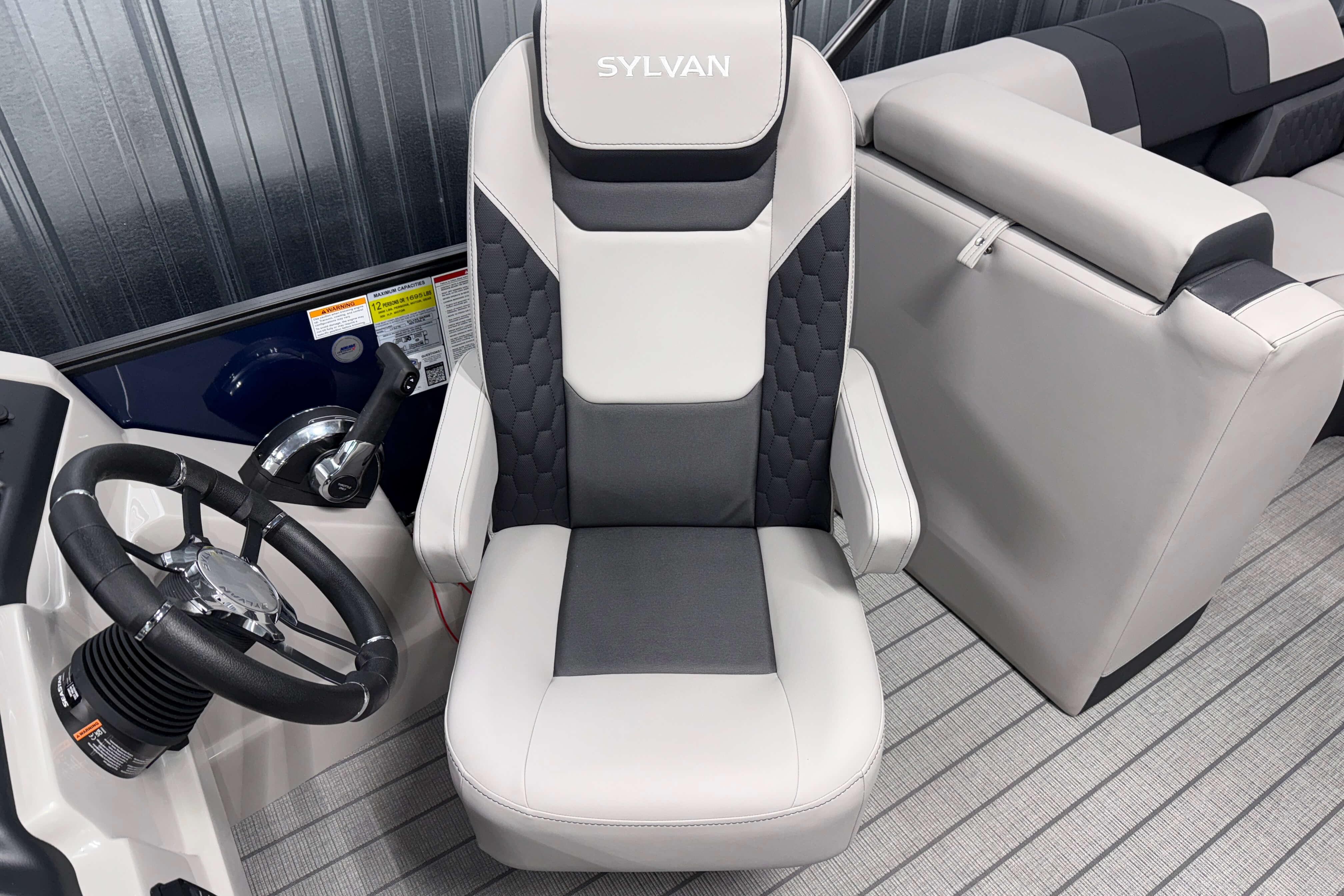 2026 Sylvan L3 SLZ boat interior with steering wheel and captain's chair.