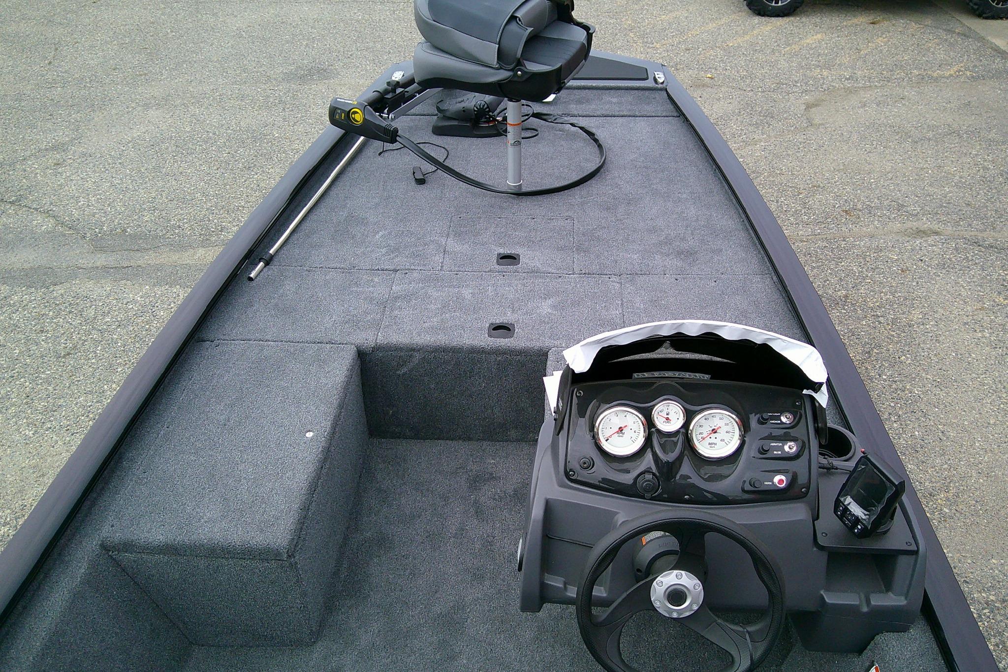 2025 Tracker Pro 170 boat interior with steering console and seating.