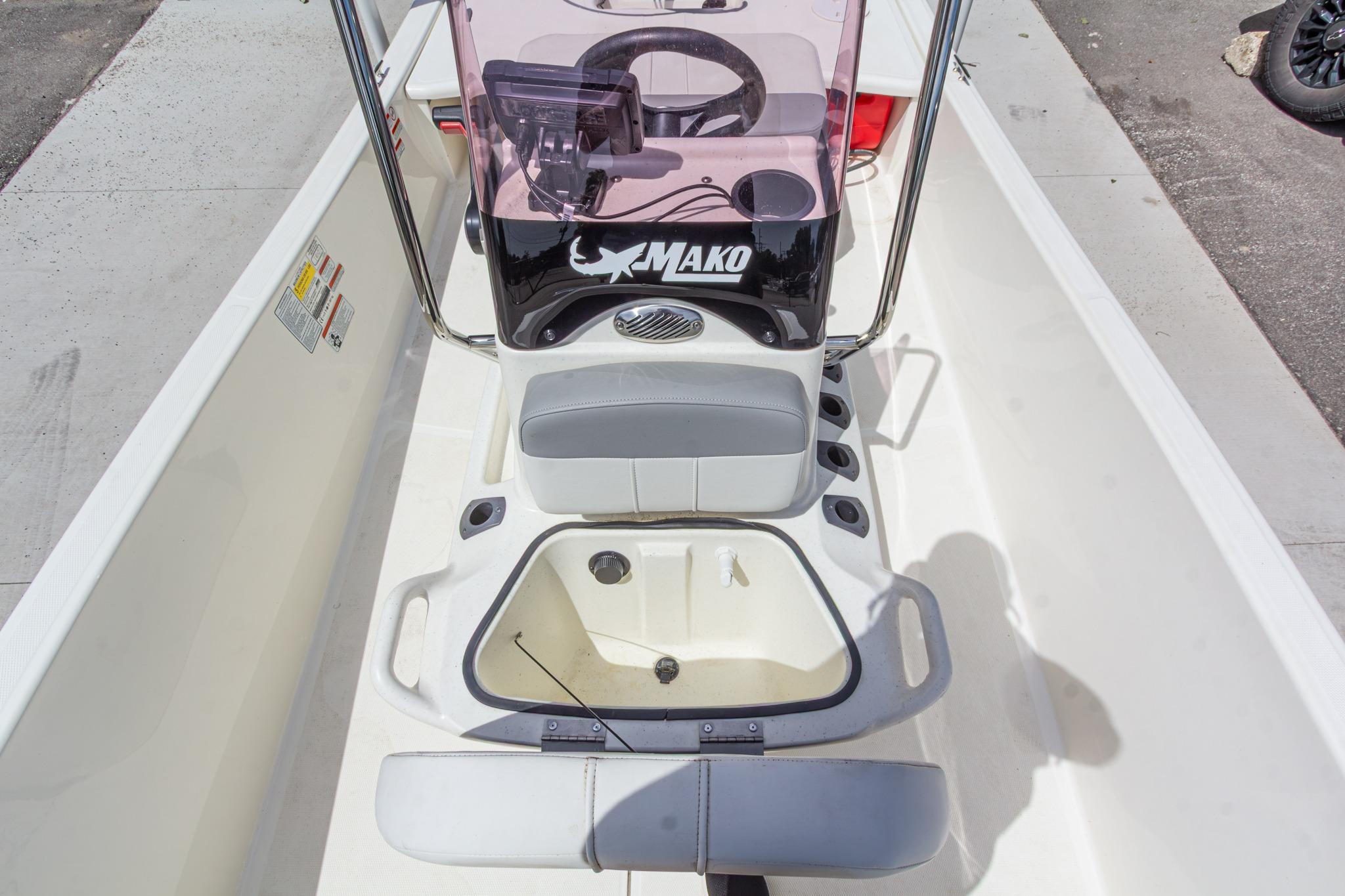 2020 Mako Pro Skiff 15 CC boat interior with steering console and seating.