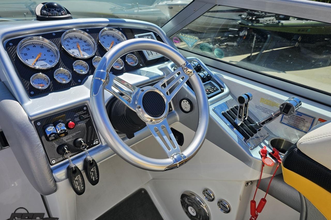 2014 Formula 292 FASTech boat dashboard with steering wheel and control gauges.