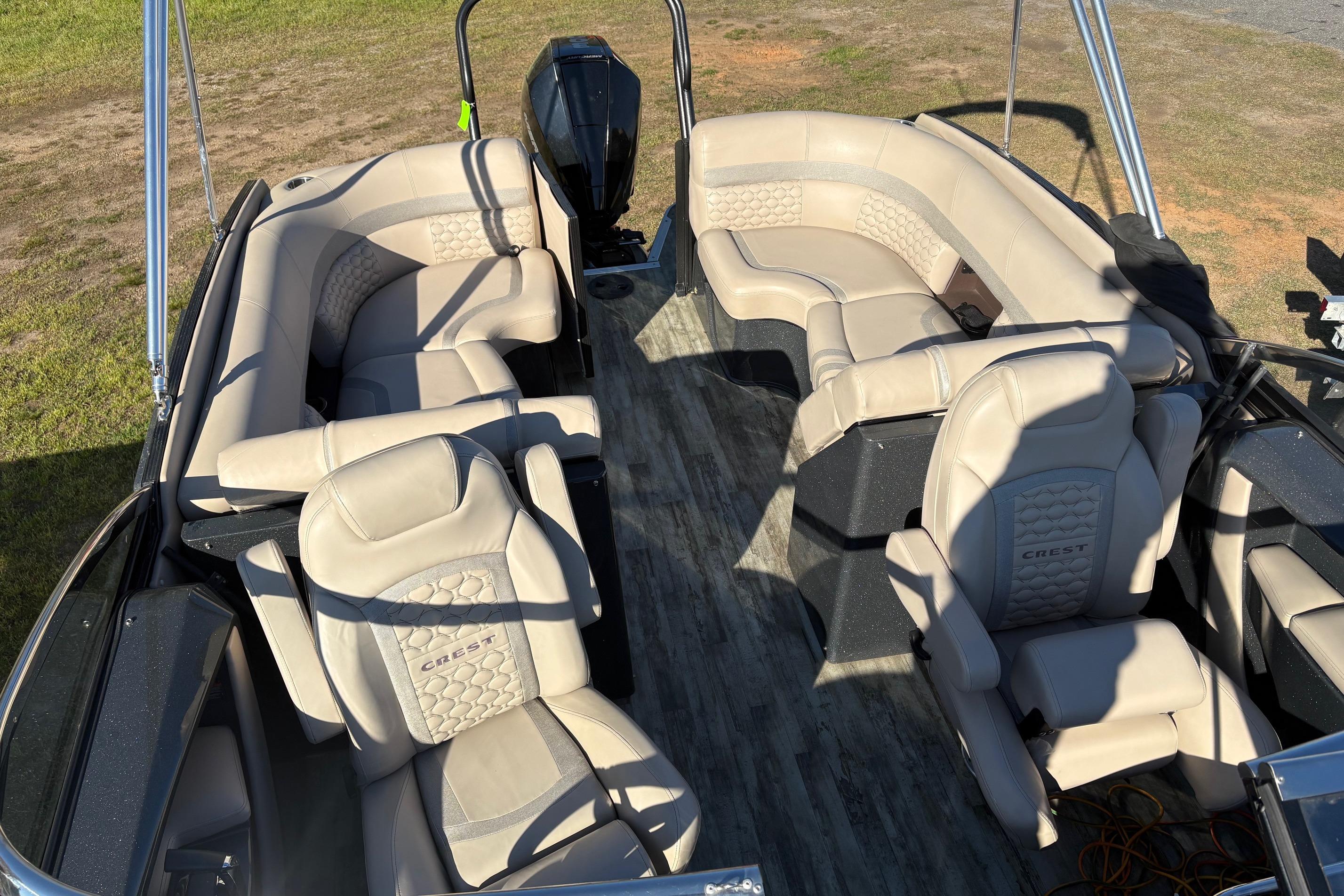 Luxurious interior of 2022 Crest Continental 250 pontoon boat with plush seating.