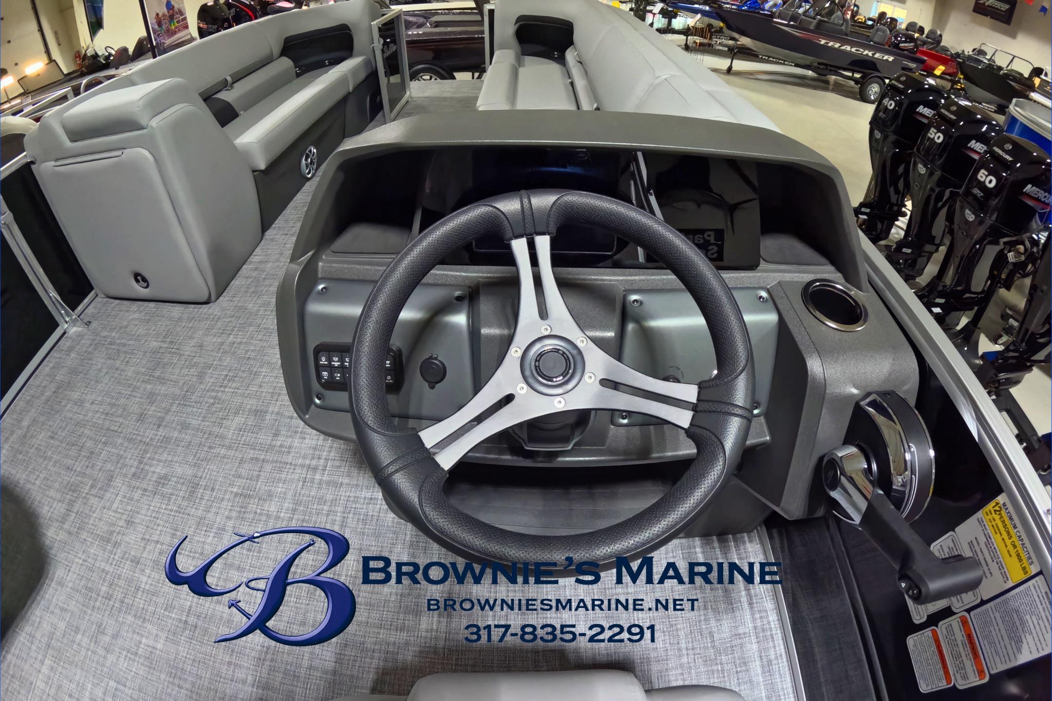 2026 Sun Tracker Party Barge 24 XP3 steering console at Brownie's Marine showroom.