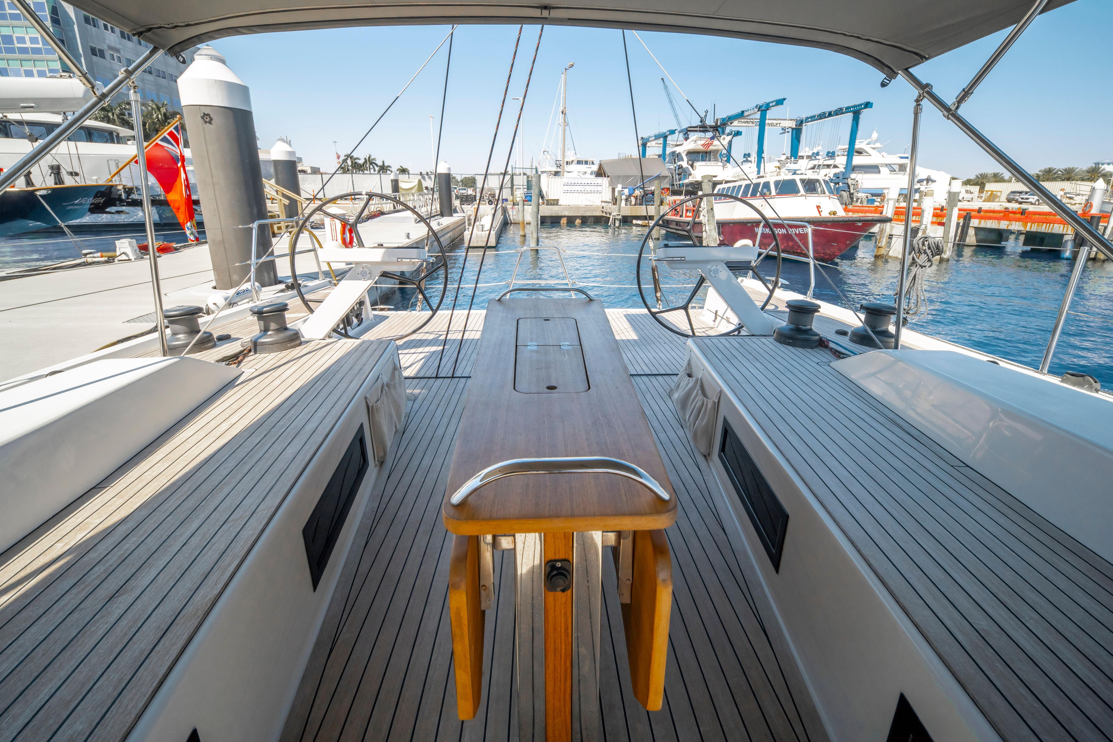 Grand Soleil 58 yacht cockpit with dual steering wheels, docked at a marina, 2016 model.