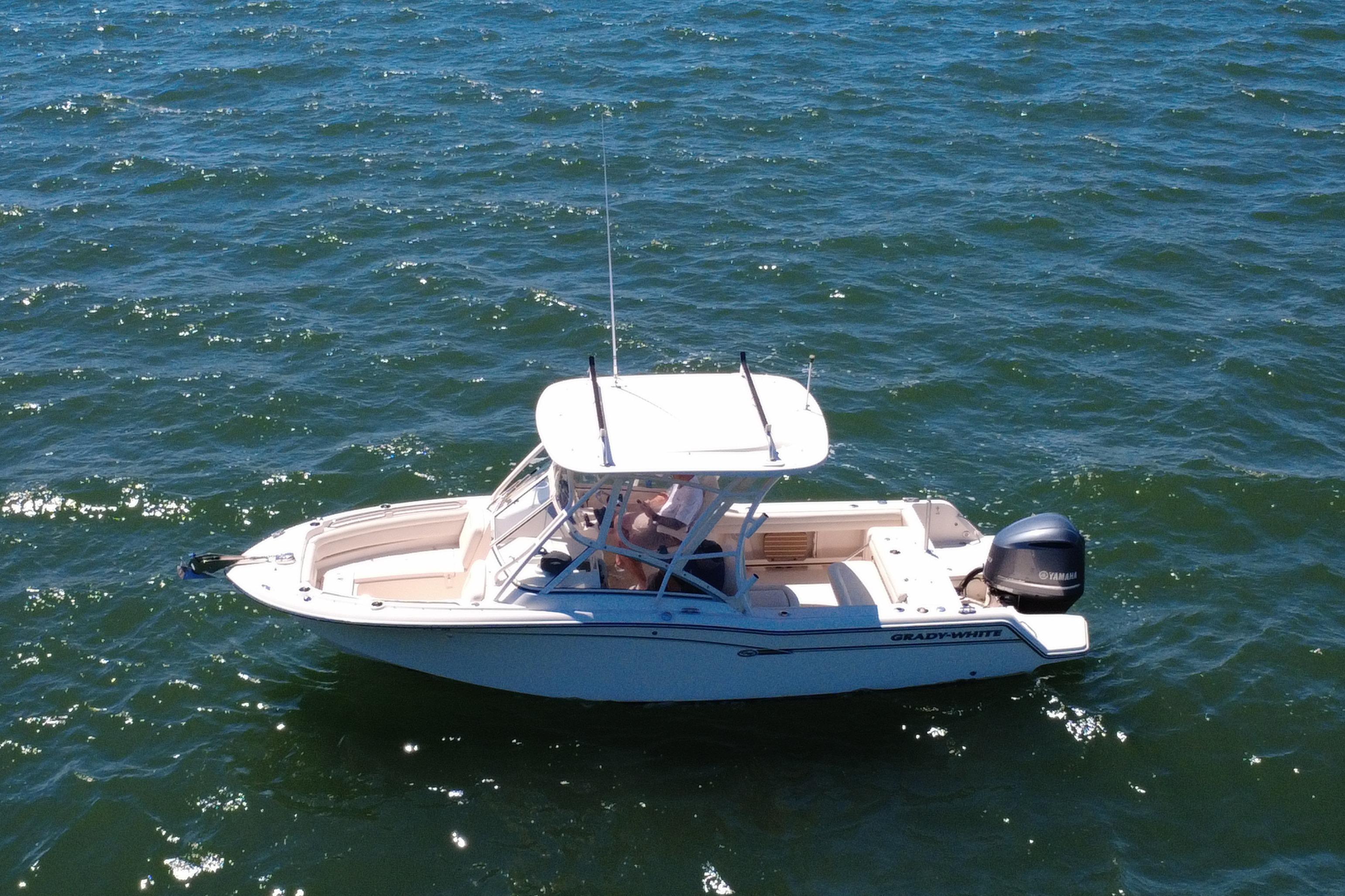 2017 Grady-White Freedom 235 boat on open water, side view.