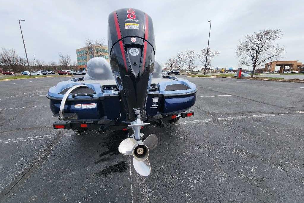 2026 Nitro Z18 Pro boat with powerful outboard motor in a parking lot.