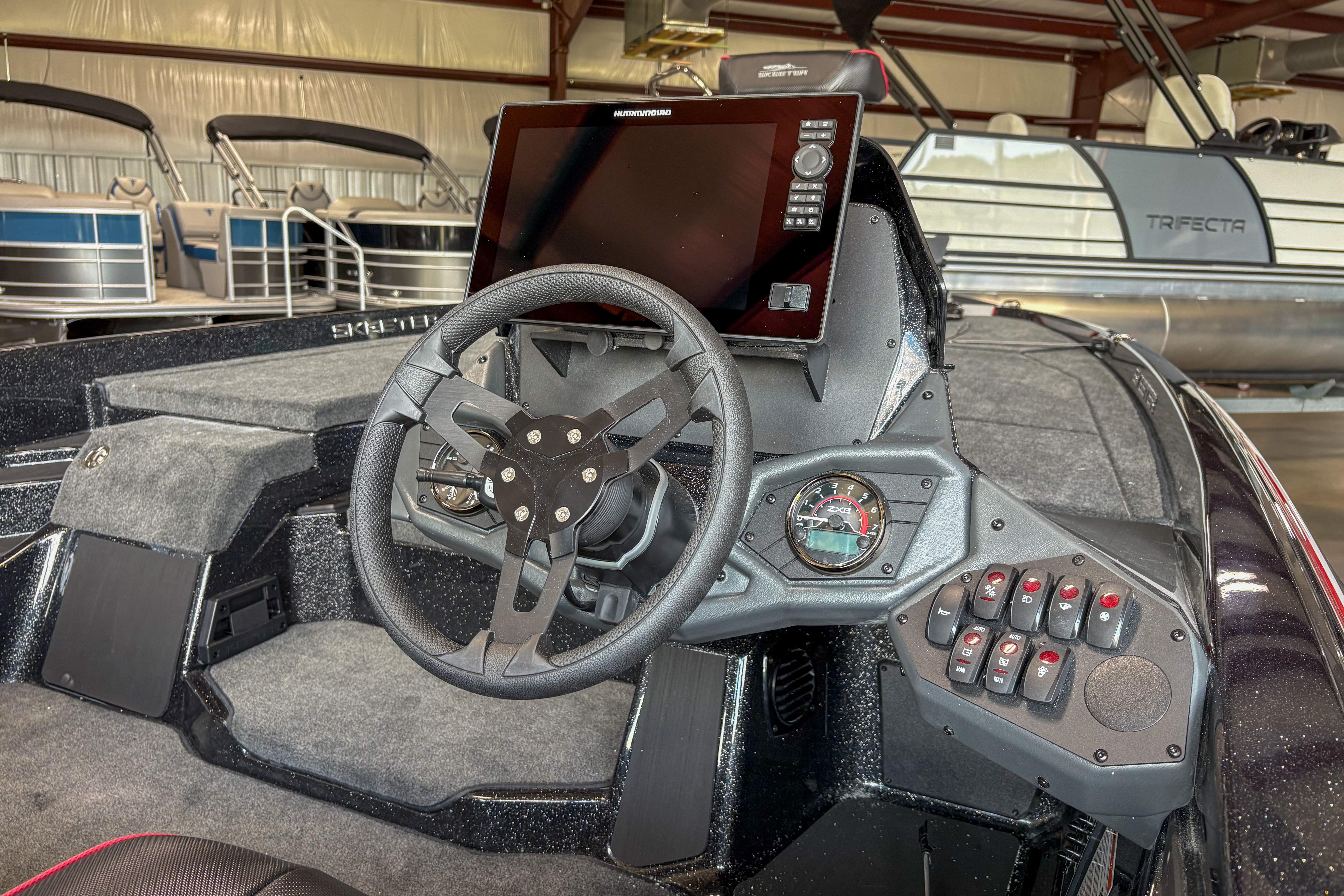 2026 Skeeter ZXE20 boat dashboard with steering wheel and control panel.