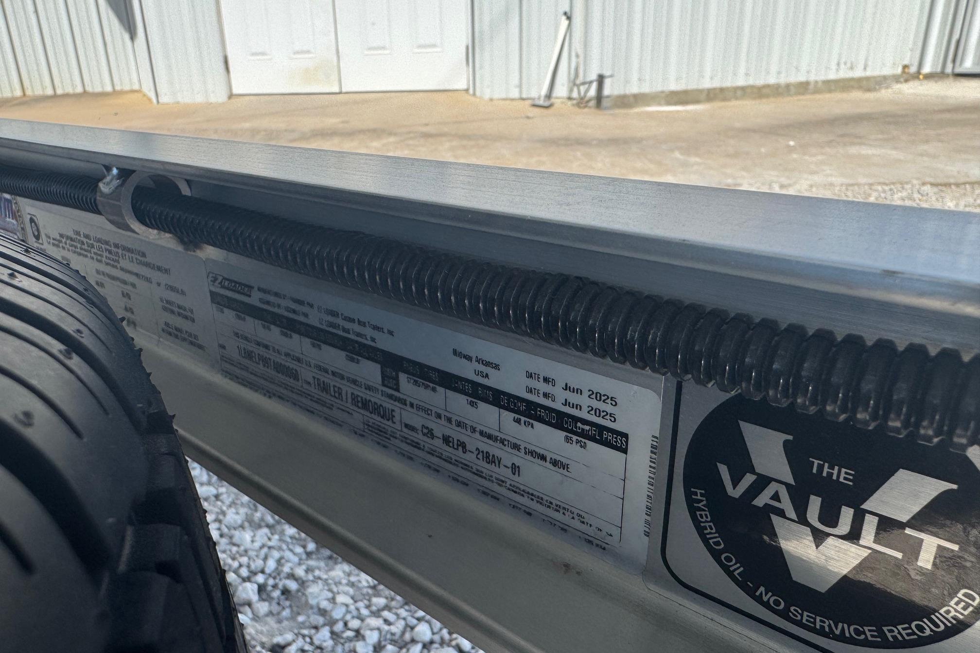 Close-up of a G3 21GX 2026 trailer label with tire and "The Vault" logo.
