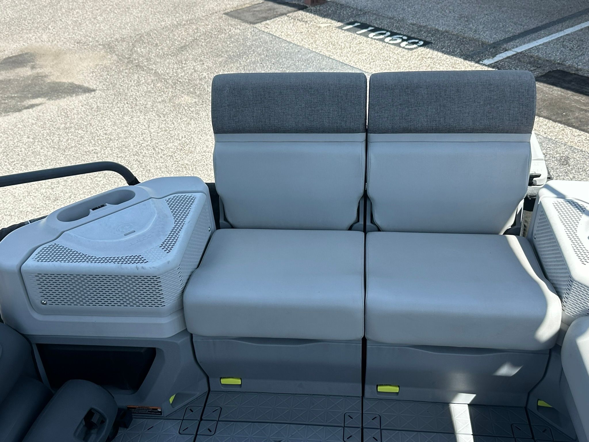 The rear seat of a 2023 Sea-Doo 21 SWITCH SPORT with gray upholstery.