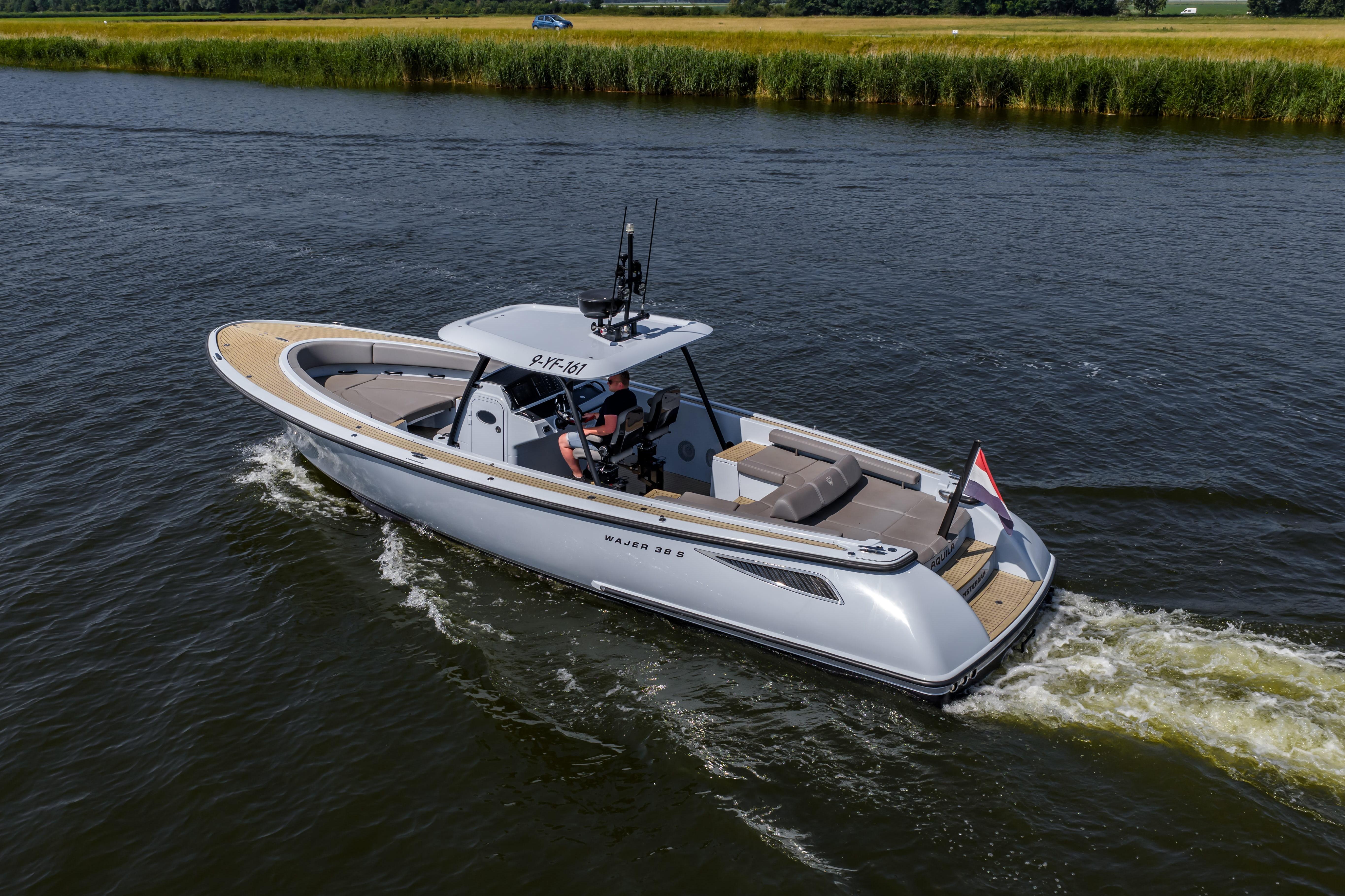 2017 Wajer 38 luxury yacht cruising on a serene waterway.