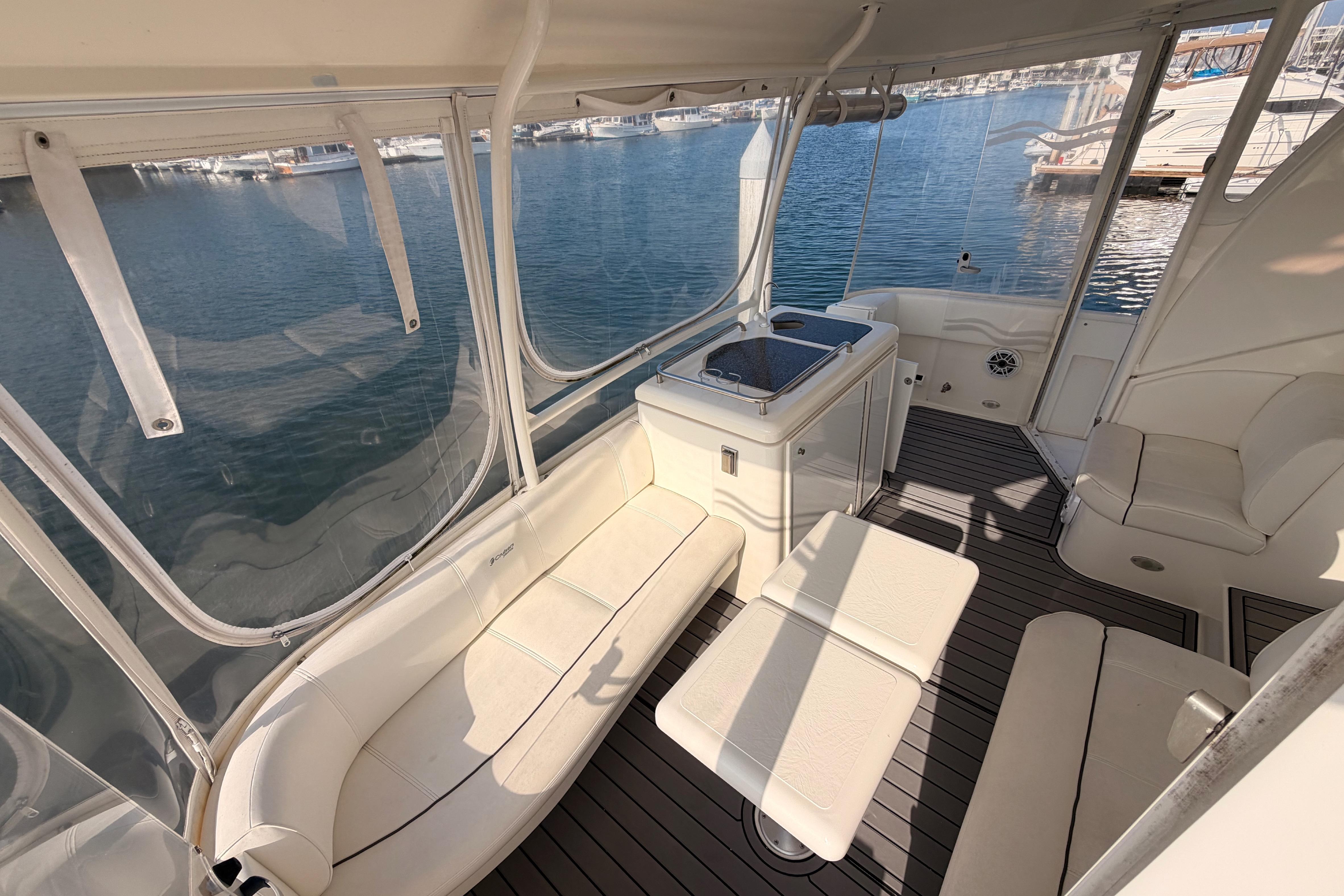 2005 Cruisers Yachts 405 Express Motoryacht interior with seating and water view.
