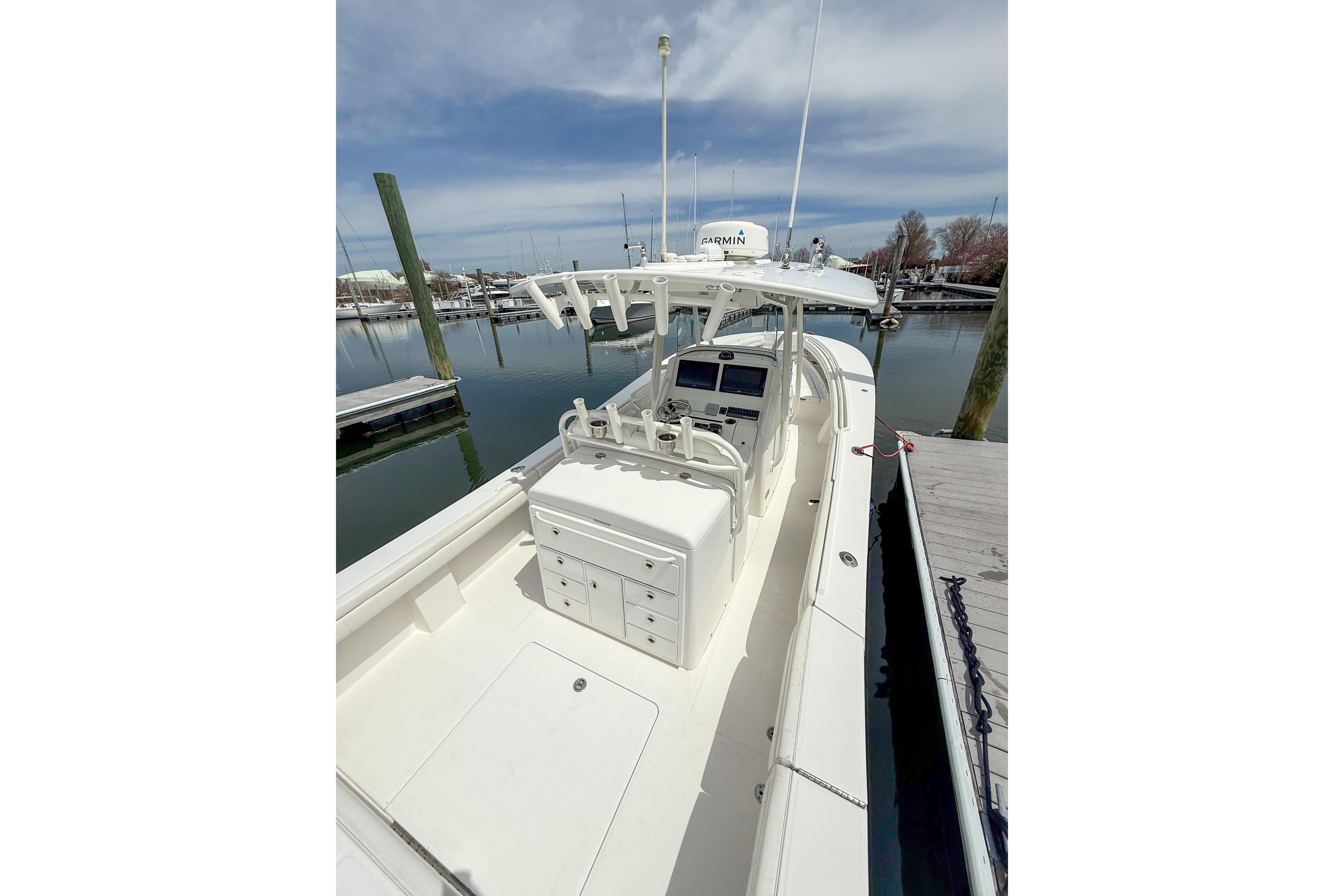 2017 Regulator 31 boat docked, featuring a spacious deck and modern navigation equipment.