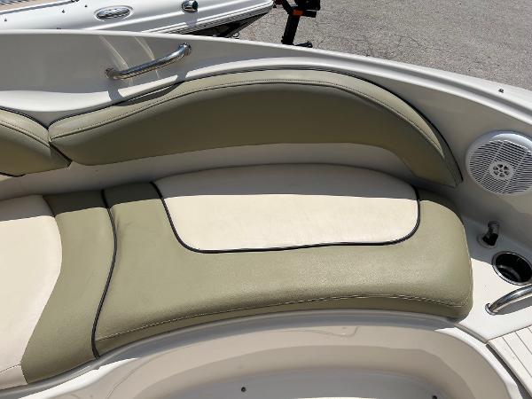 2005 Sea Ray 220 Sundeck boat interior with beige and olive seating.