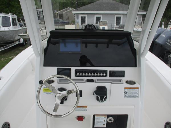 2025 Sea Fox 228 Commander boat dashboard with steering wheel and control panel.
