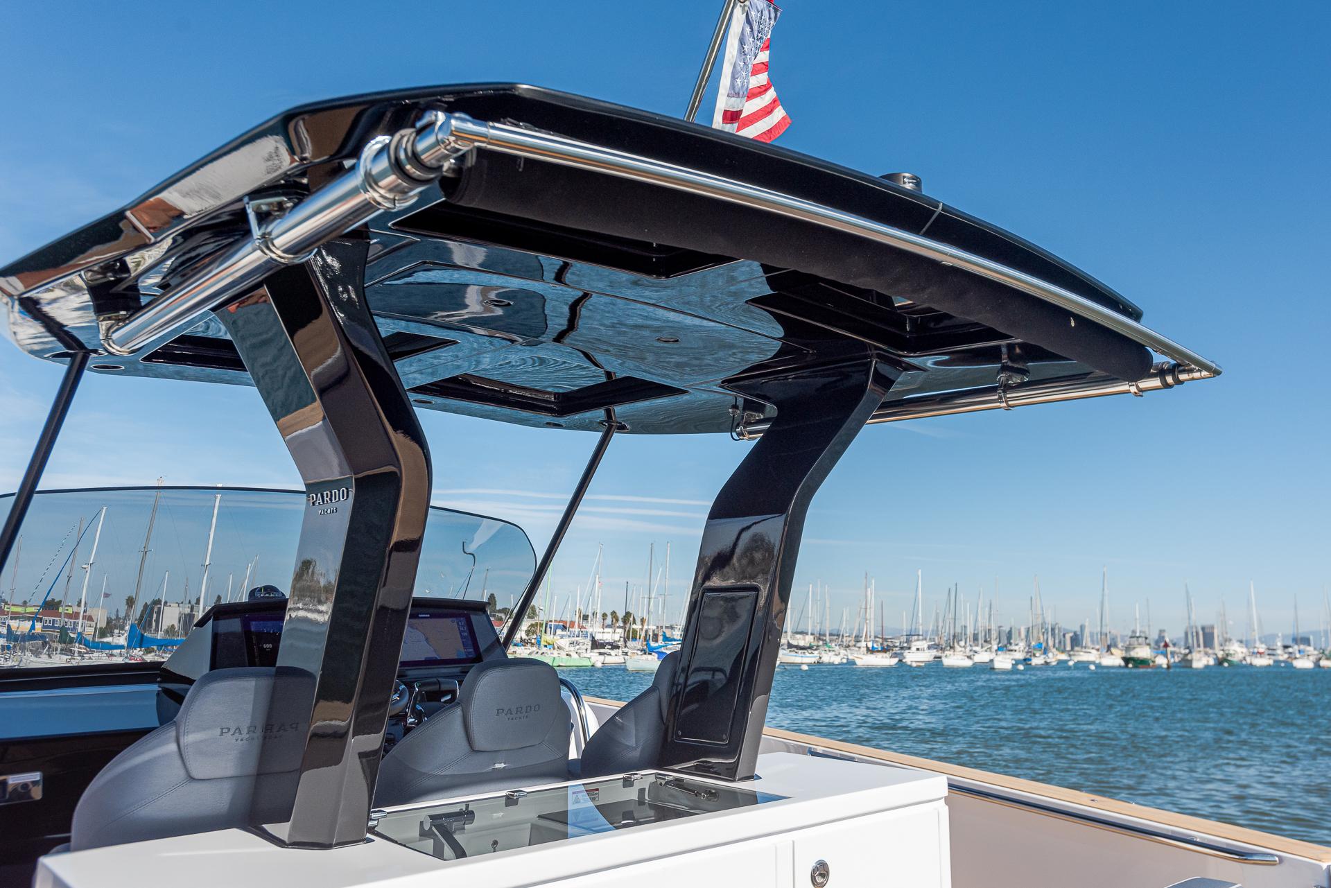 2023 Pardo Yachts P38 with sleek design, docked in a marina under clear blue skies.