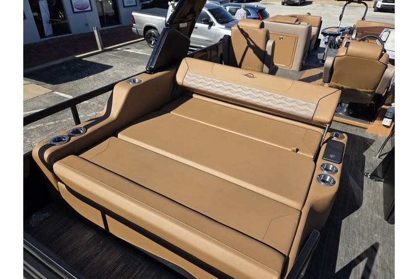 2026 SunCatcher Diamond Elite 326 SL boat interior with tan seating and cup holders.