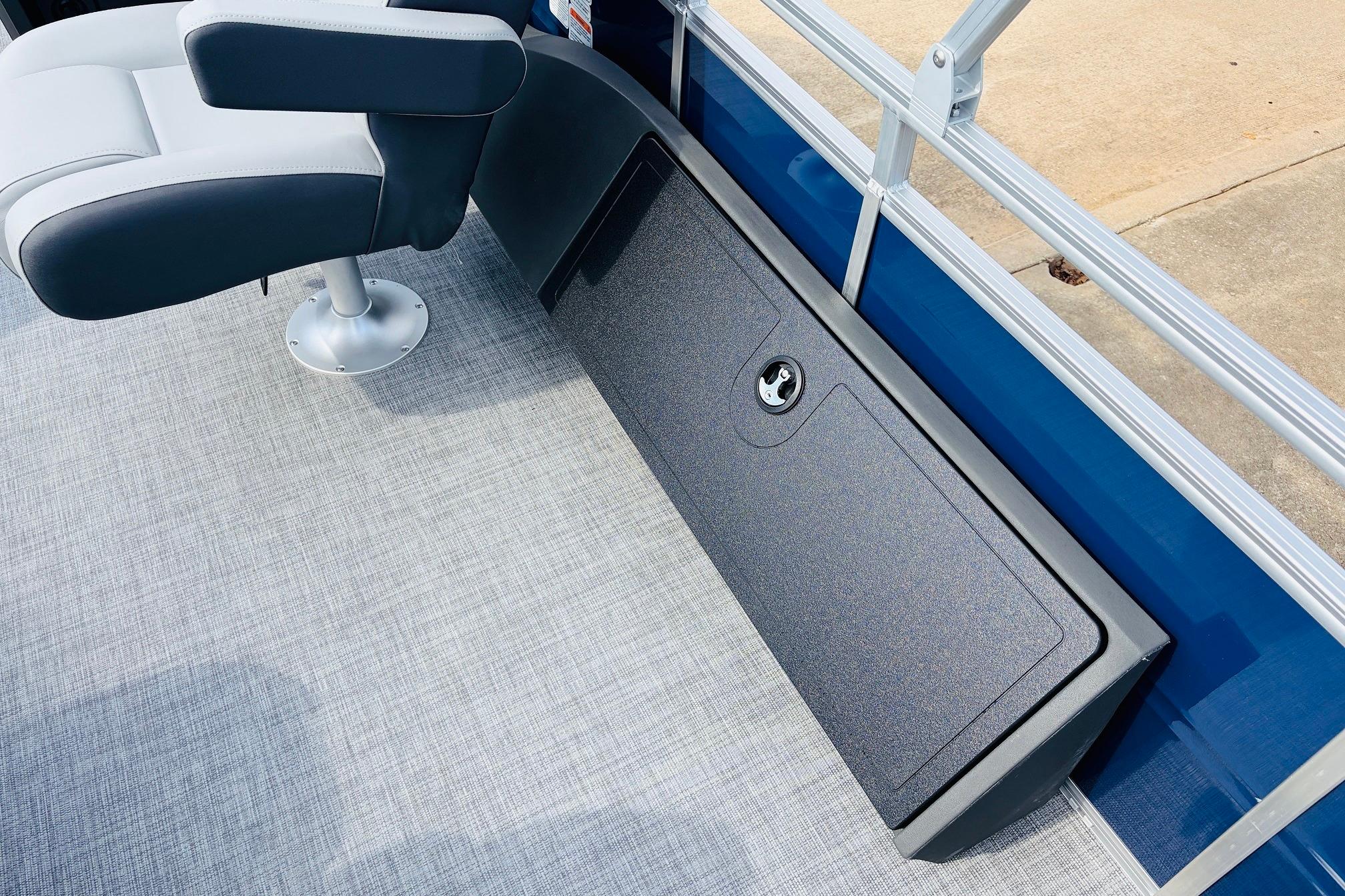 2026 Sun Tracker SportFish 22 DLX boat interior with seating and storage compartment.